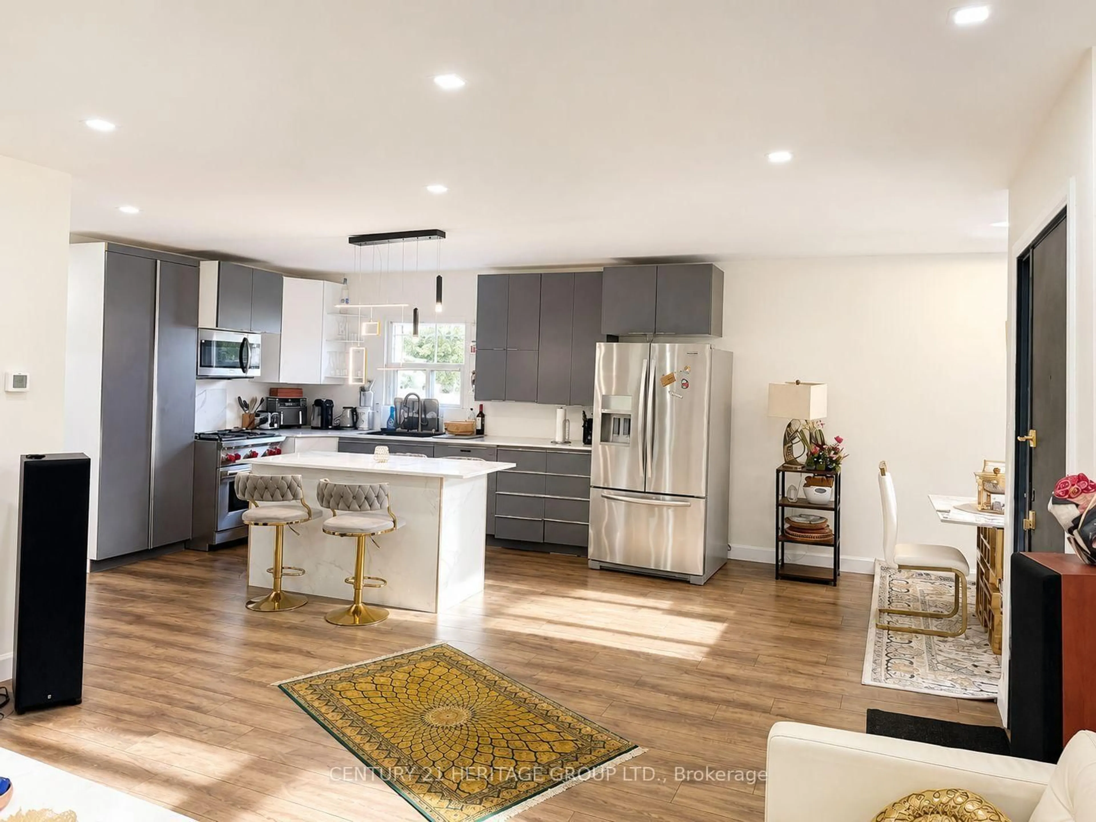 Open concept kitchen, wood/laminate floor for 124 Regina Ave, Toronto Ontario M6A 1R7