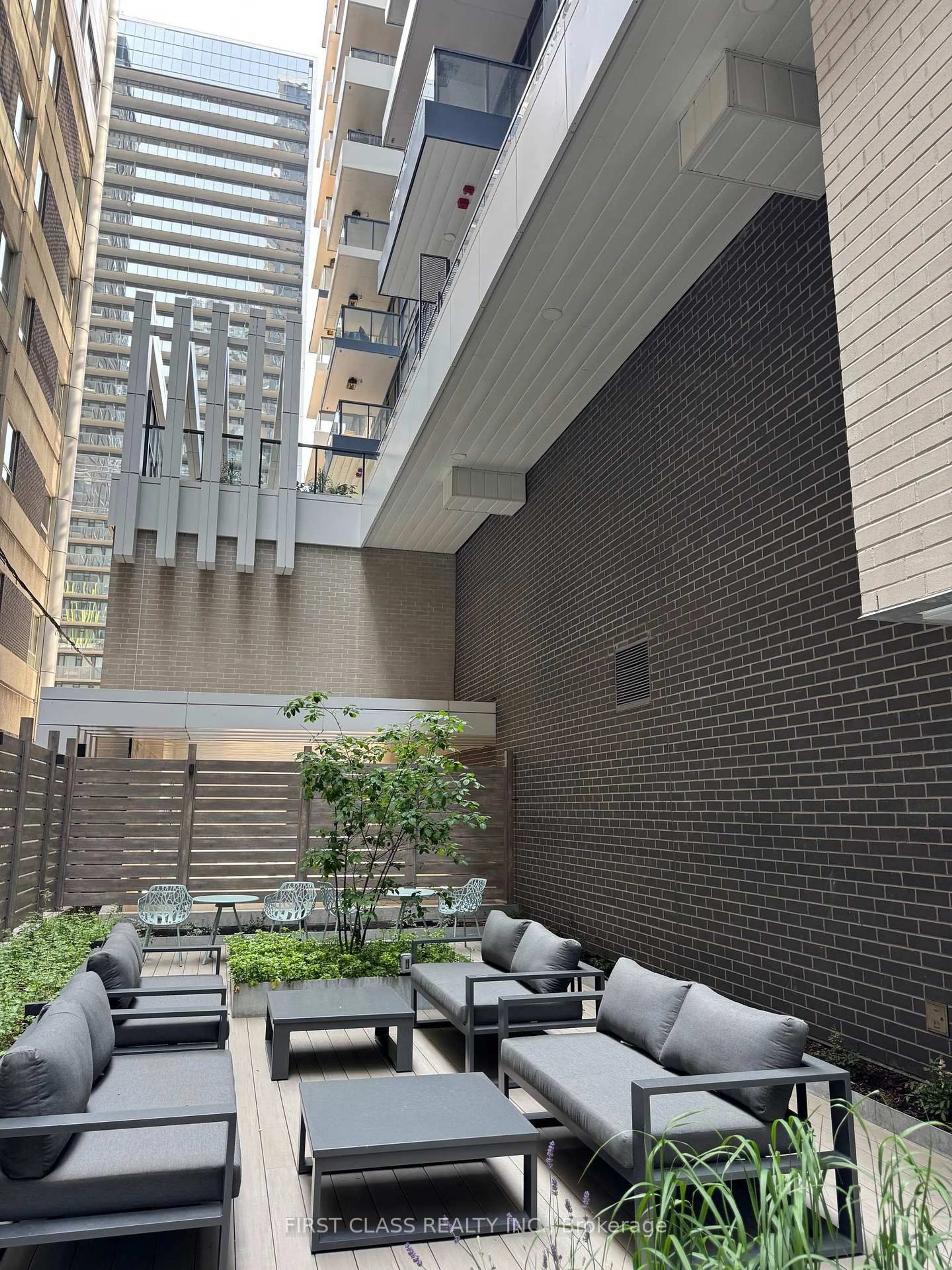 Patio, city buildings view from balcony for 38 Widmer St #710, Toronto Ontario M5V 2E9