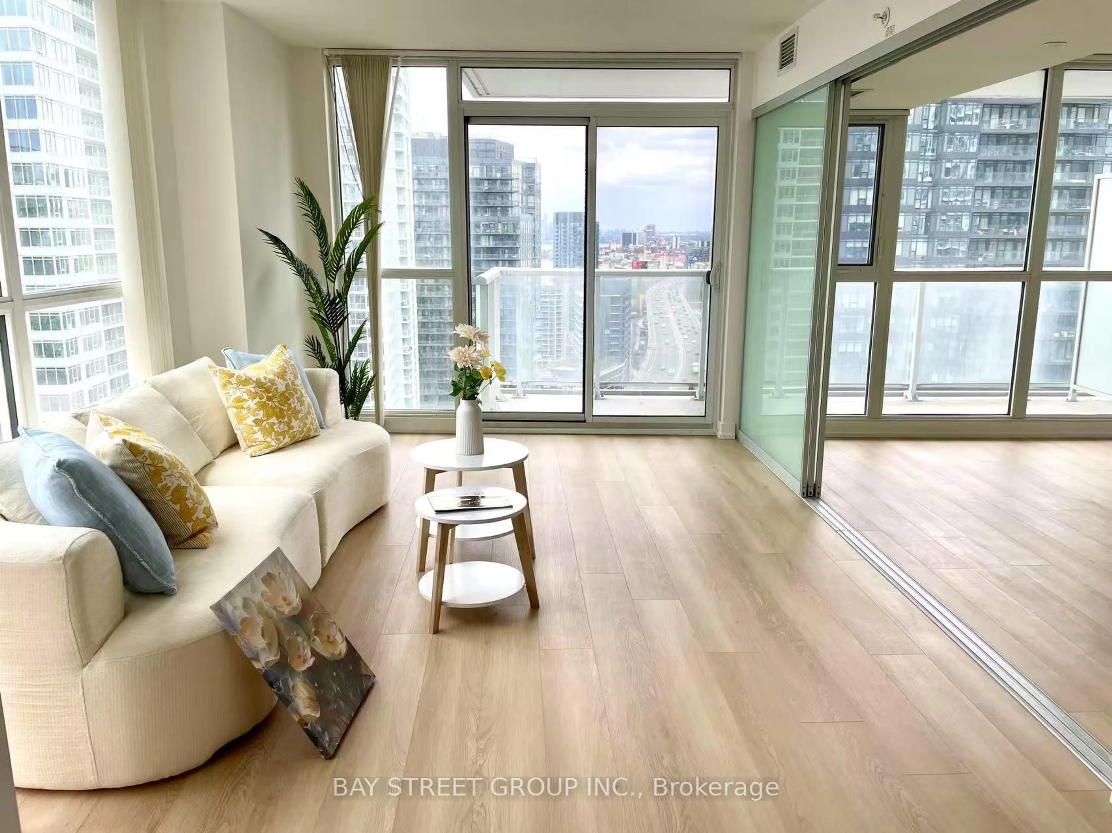 Living room with furniture, wood/laminate floor for 75 Queens Wharf Rd #2908, Toronto Ontario M5V 0J8