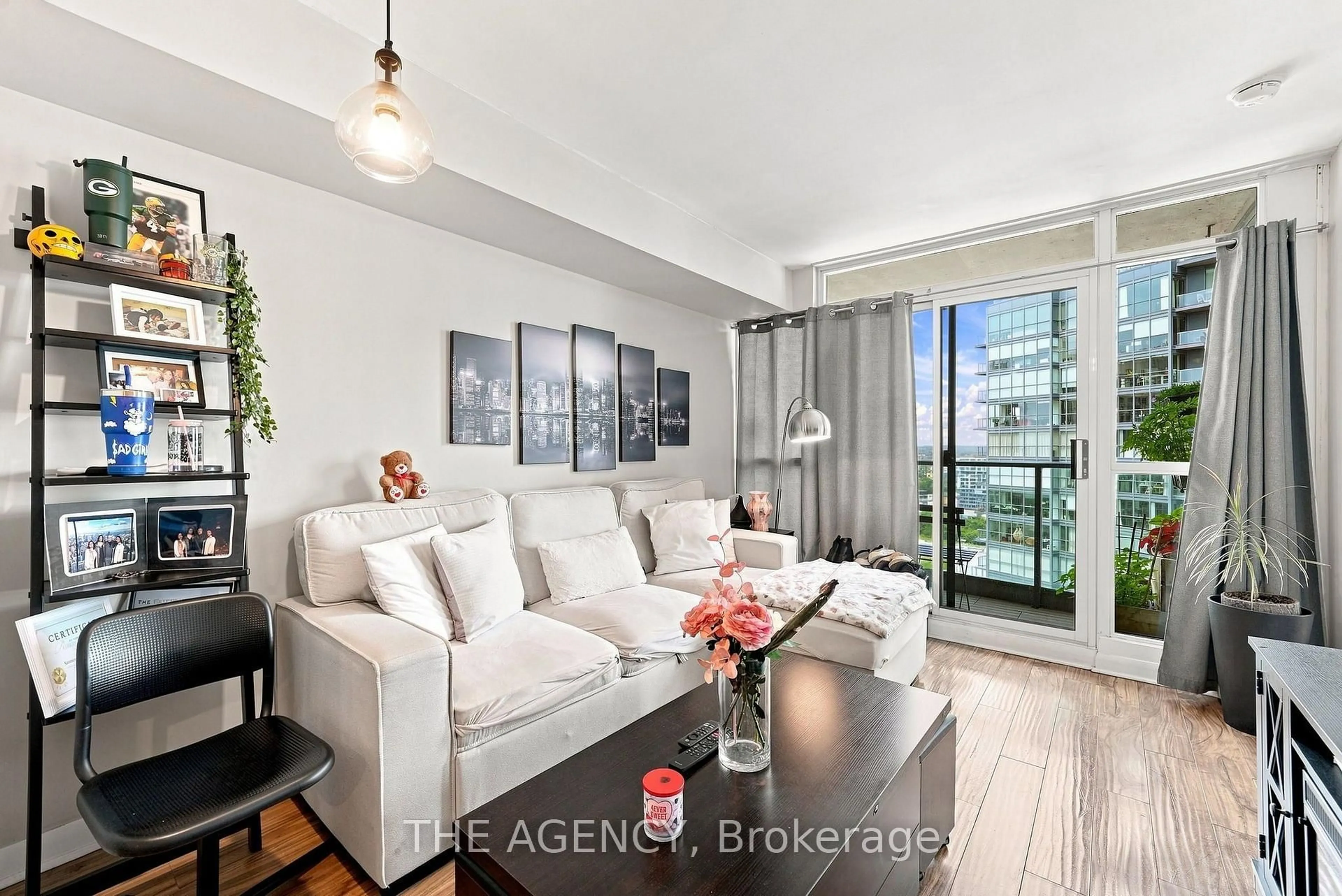 Living room with furniture, wood/laminate floor for 600 Fleet St #2301, Toronto Ontario M5V 1B7