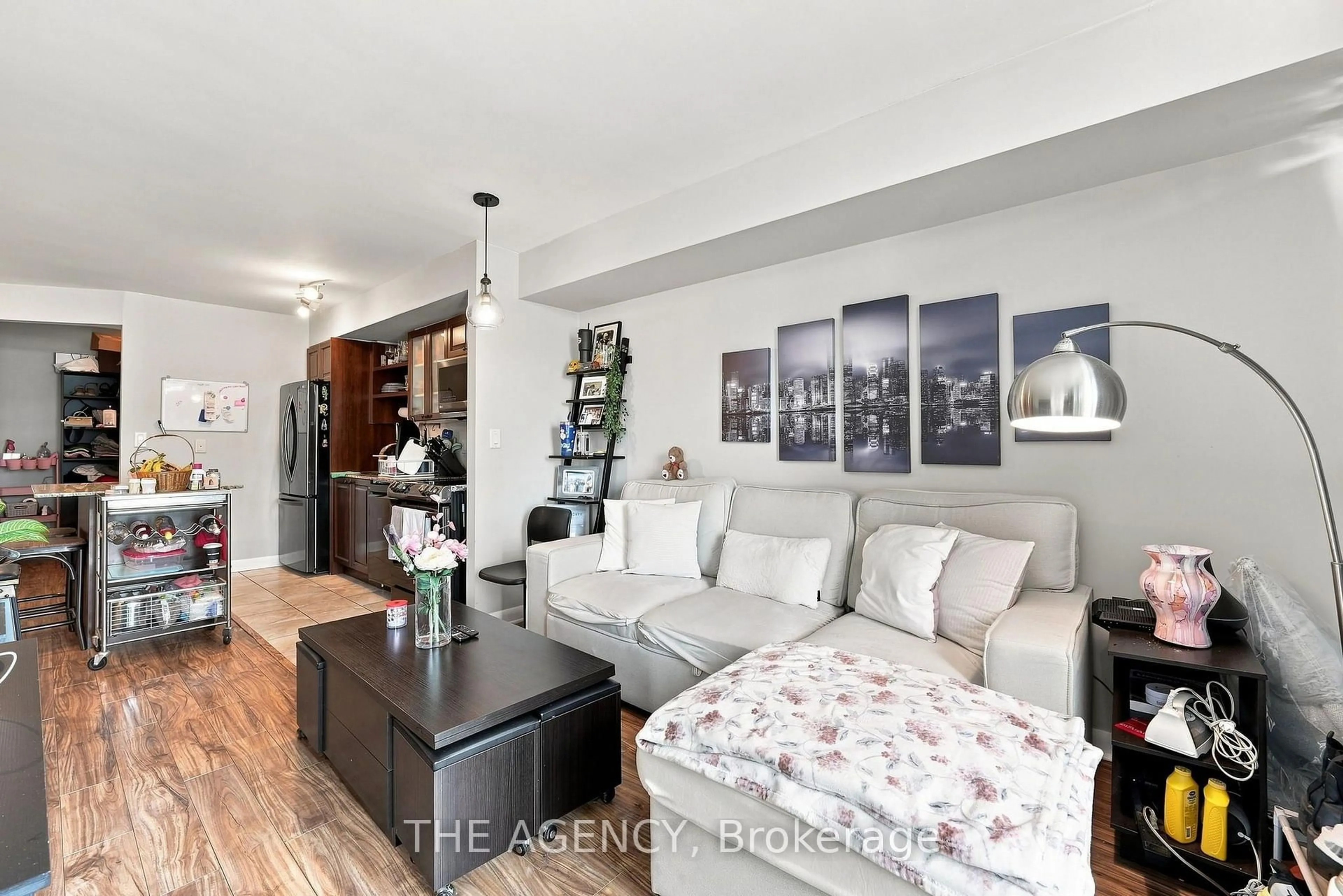 Living room with furniture, wood/laminate floor for 600 Fleet St #2301, Toronto Ontario M5V 1B7