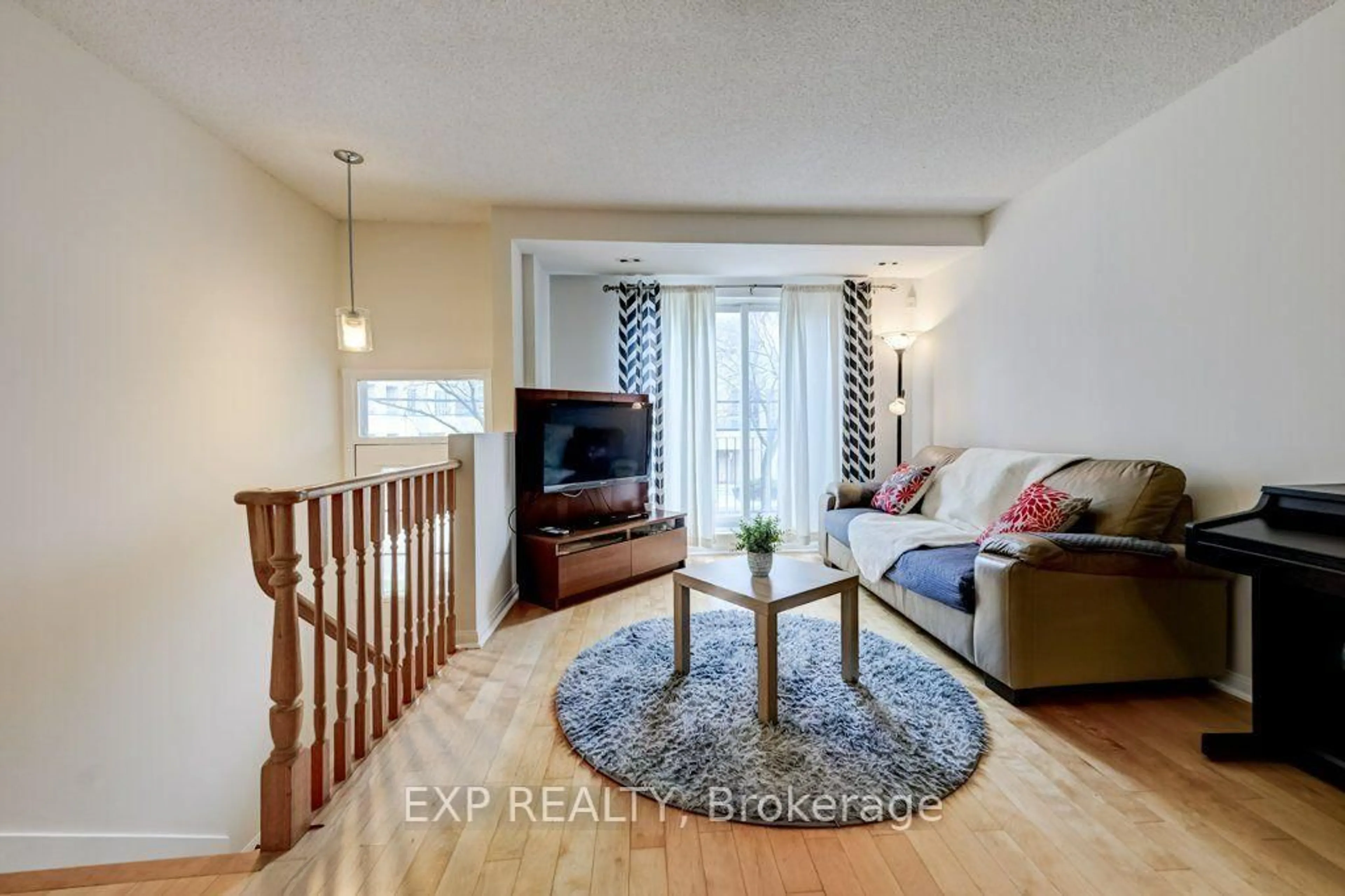 Living room with furniture, wood/laminate floor for 28 Sommerset Way #1716, Toronto Ontario M2N 6W7