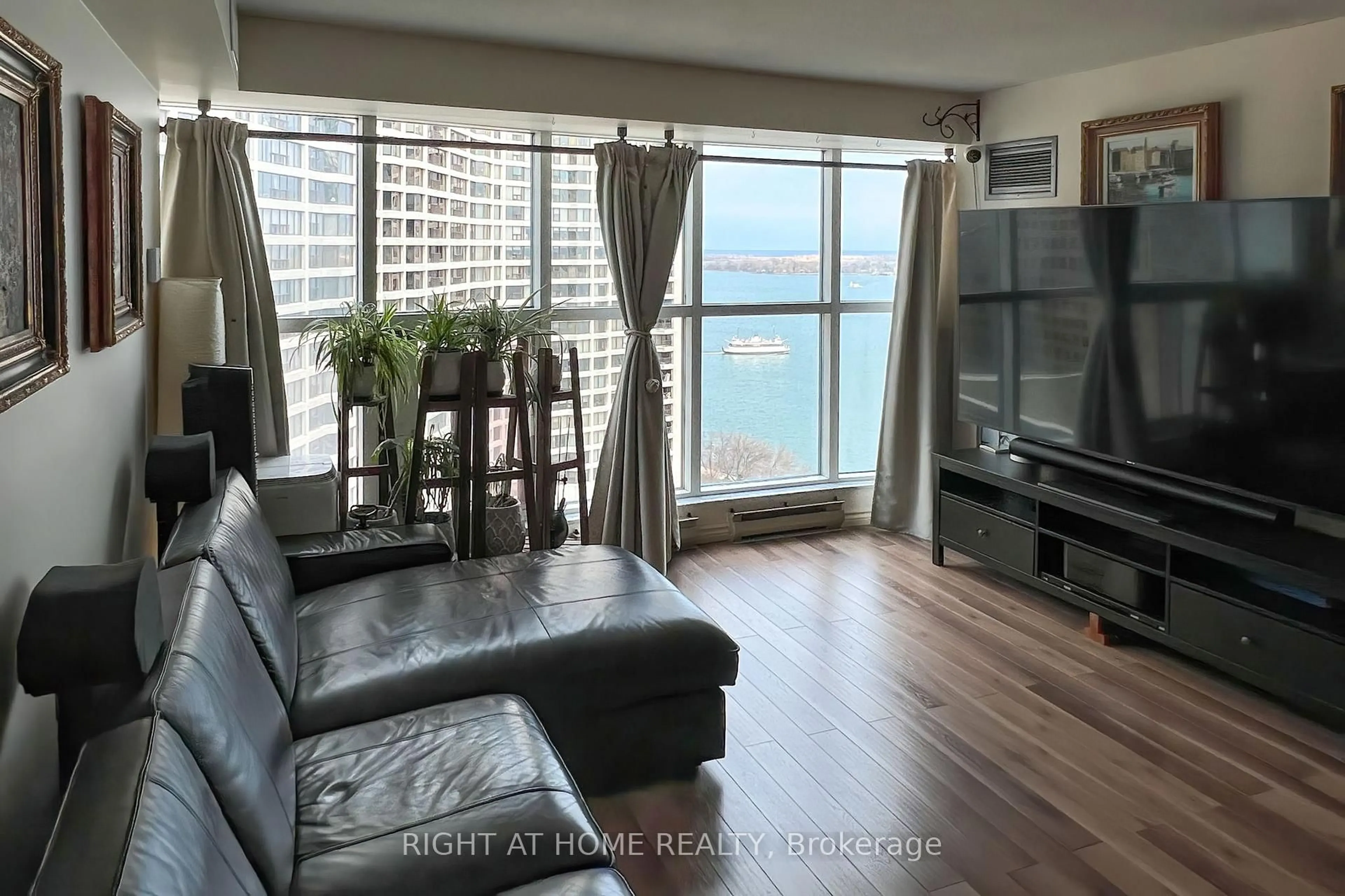 Living room with furniture, wood/laminate floor for 77 Harbour Sq #2306, Toronto Ontario M5J 2S2