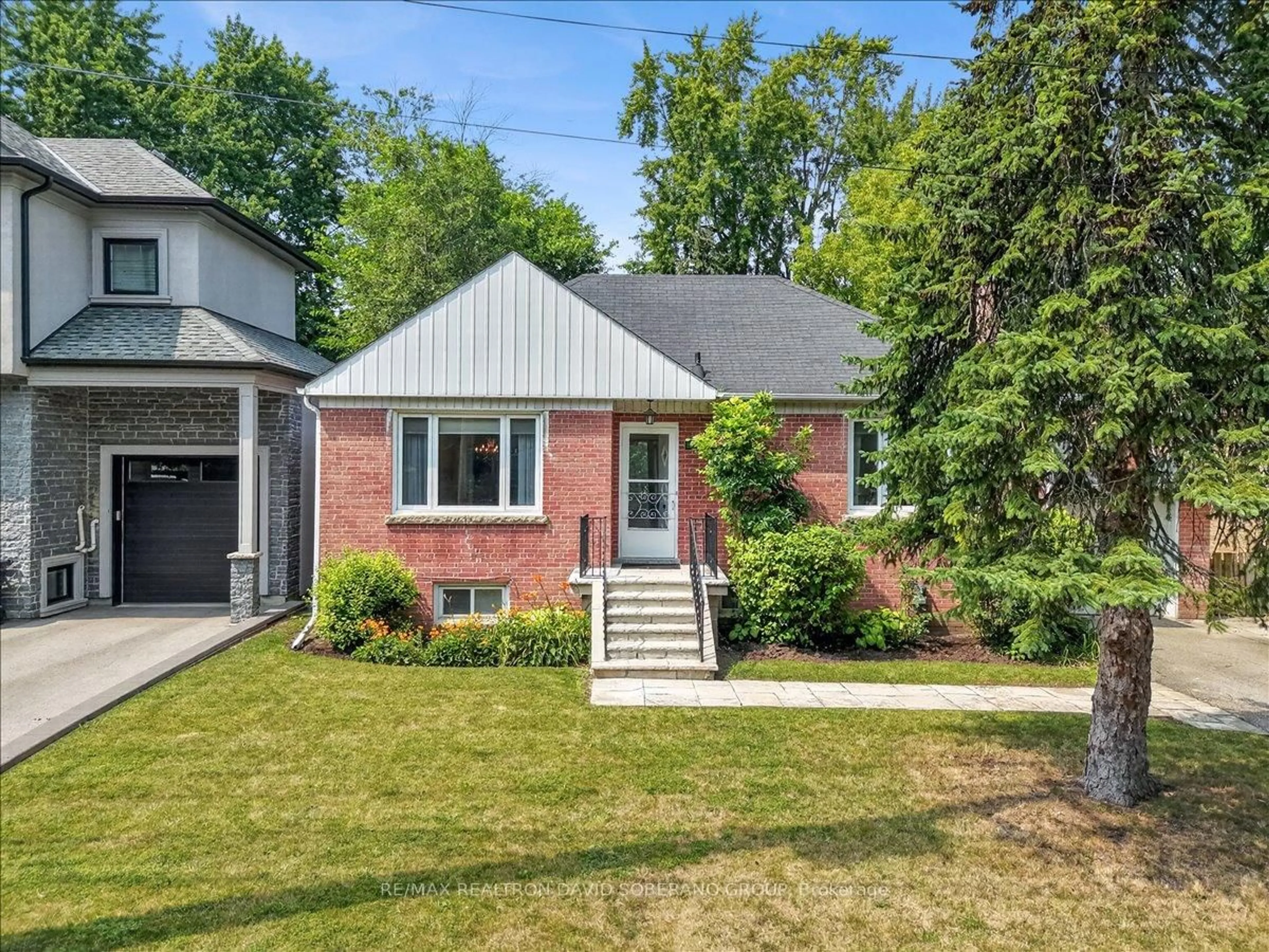 Home with brick exterior material, street for 42 De Quincy Blvd, Toronto Ontario M3H 1Y5