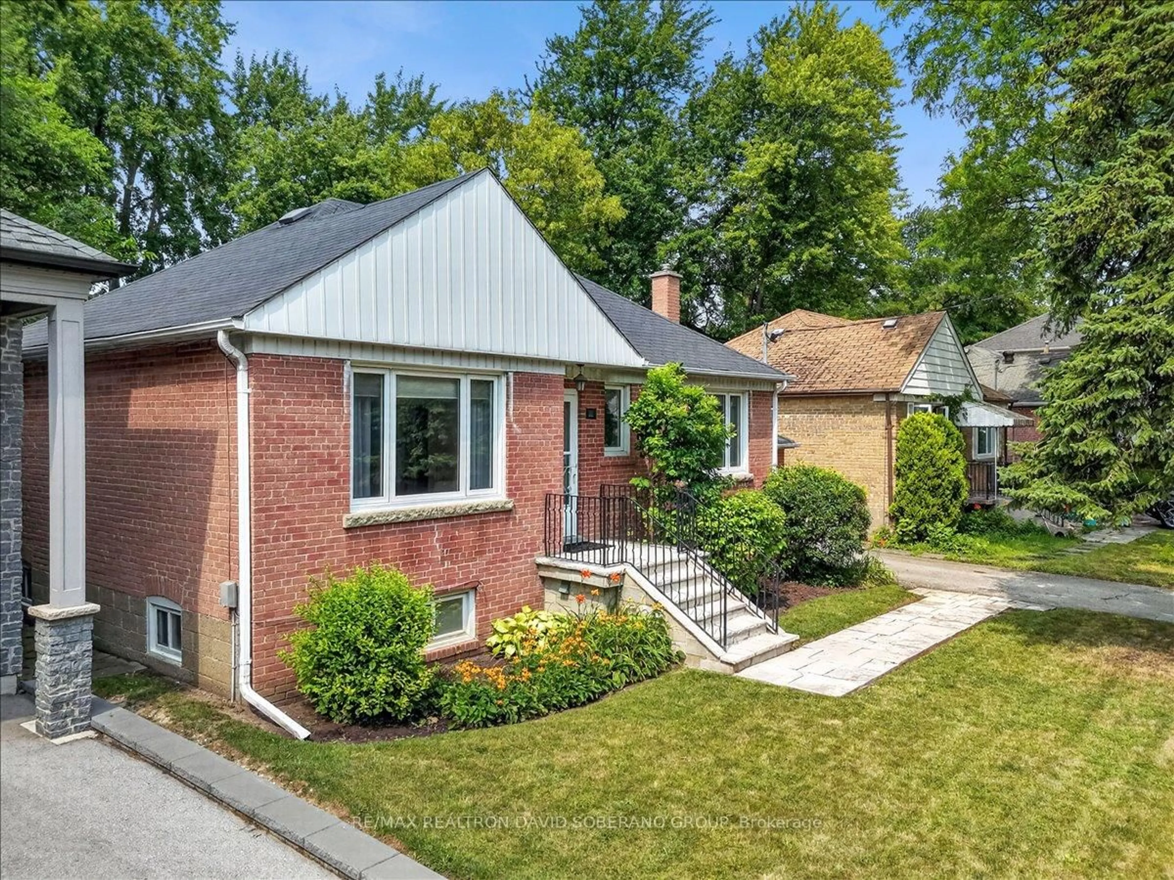 Home with brick exterior material, street for 42 De Quincy Blvd, Toronto Ontario M3H 1Y5