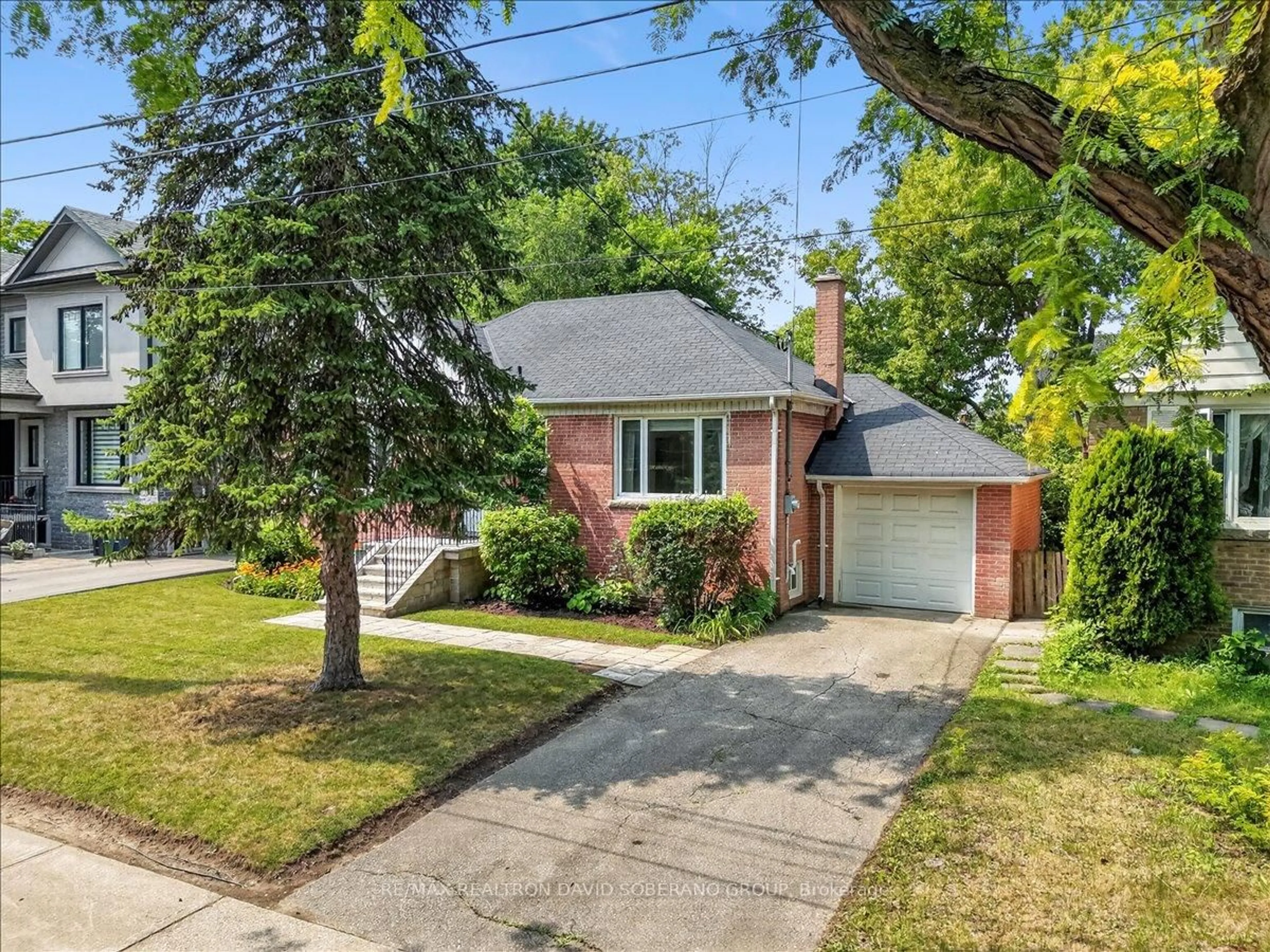 Home with brick exterior material, street for 42 De Quincy Blvd, Toronto Ontario M3H 1Y5