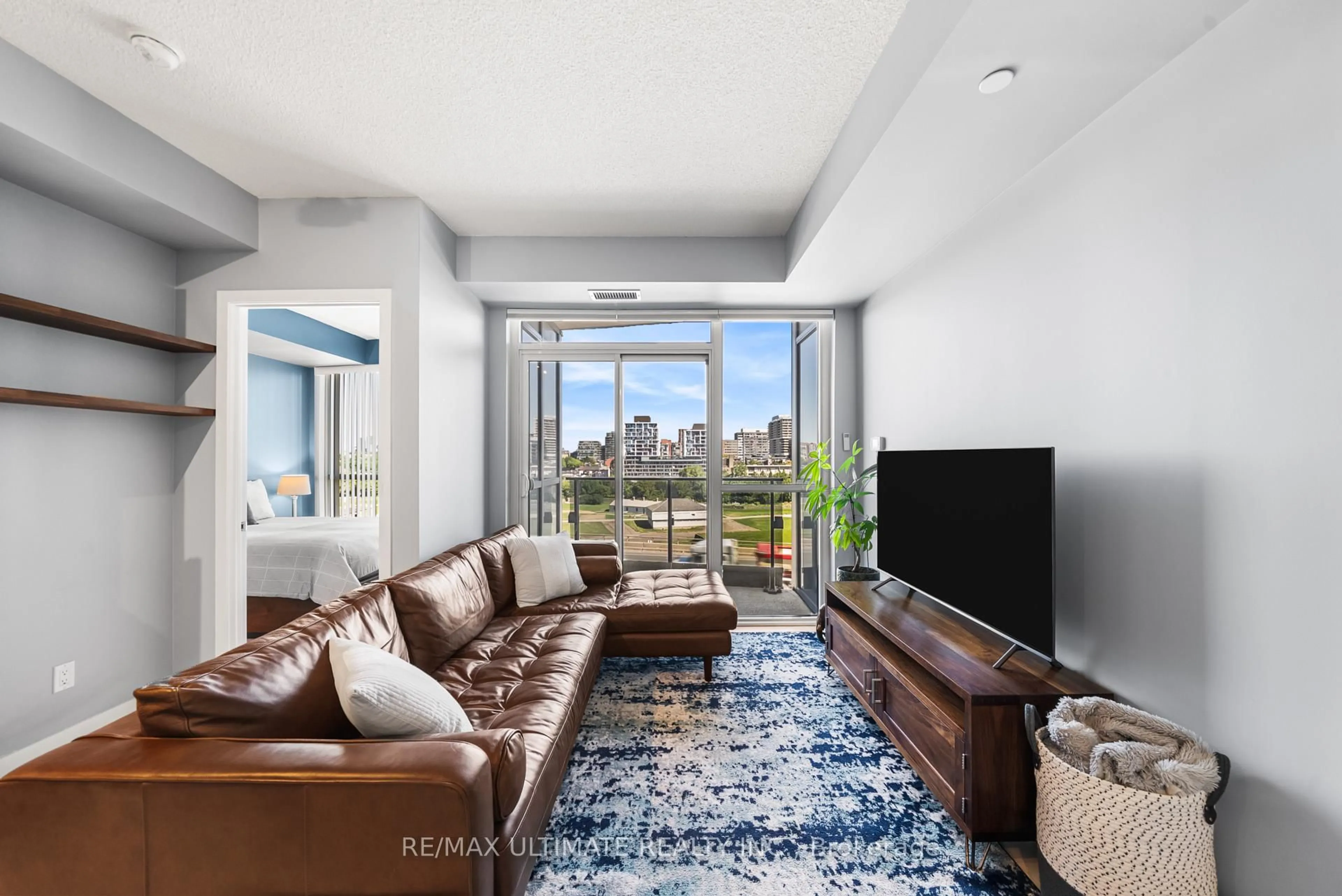 Living room with furniture, unknown for 50 Bruyeres Mews #1001, Toronto Ontario M5V 0A7