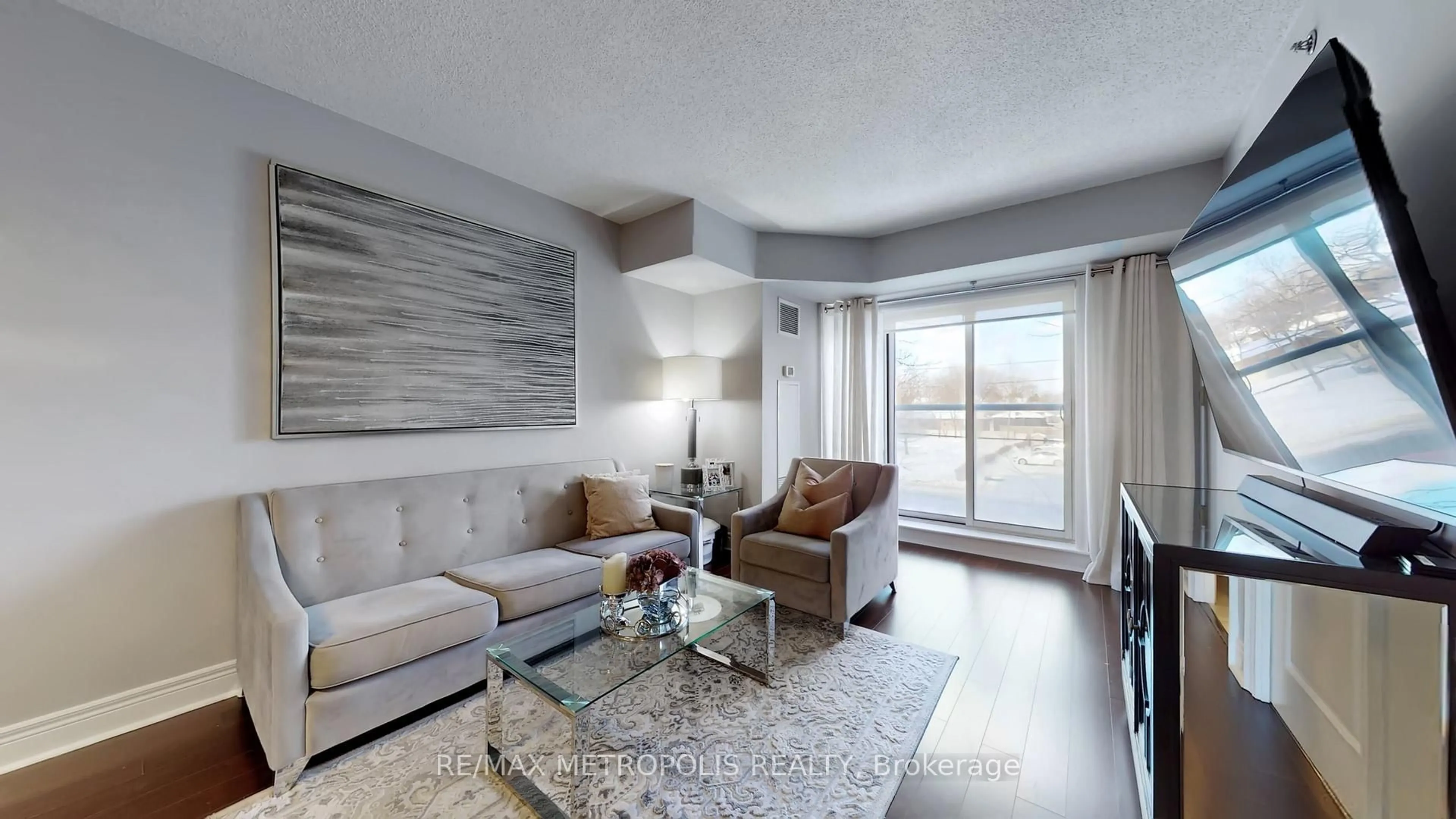 Living room with furniture, wood/laminate floor for 701 Sheppard Ave #228, Toronto Ontario M3H 0B2