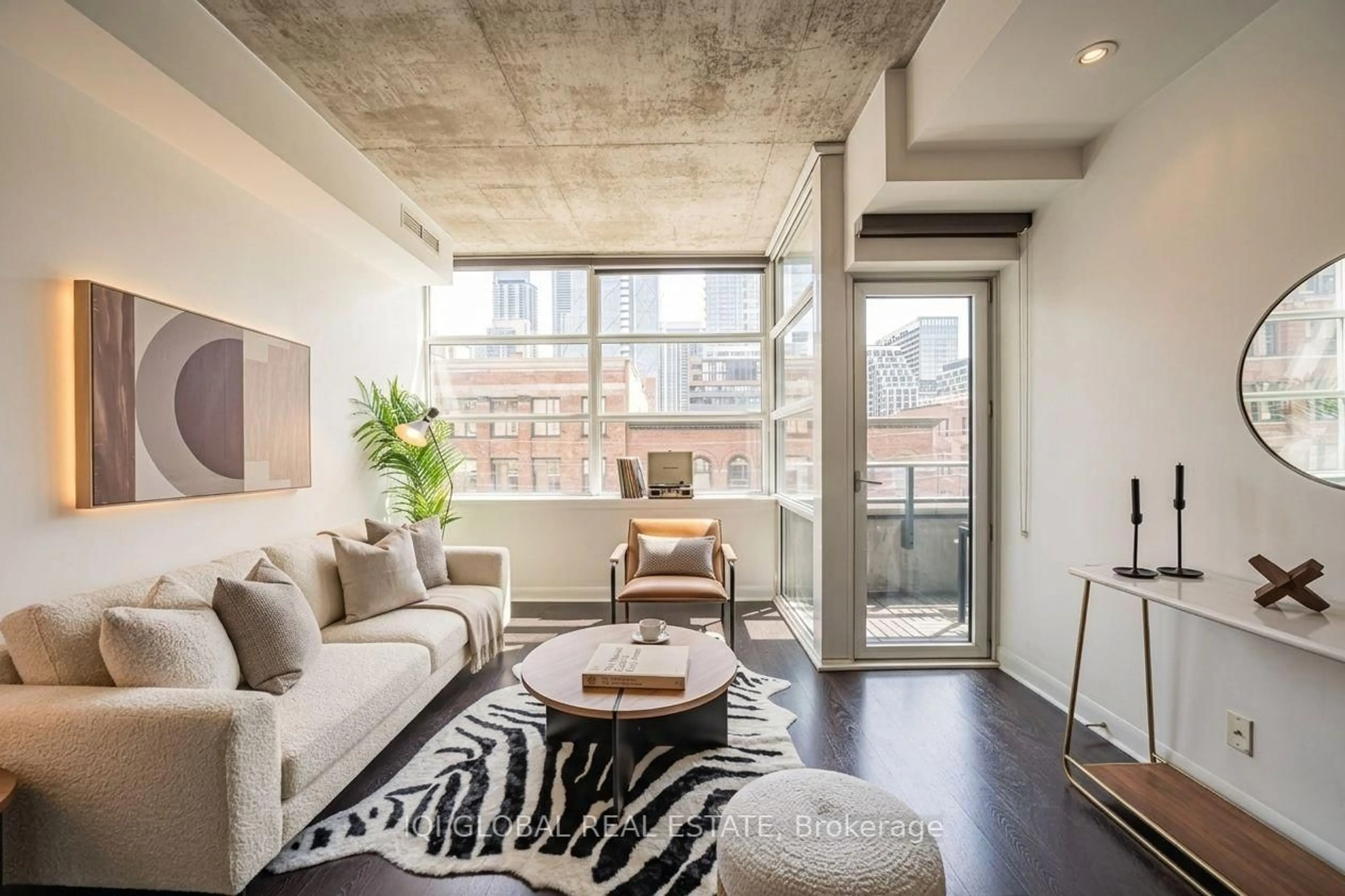 Living room with furniture, cement floor for 478 King St #406, Toronto Ontario M5V 0A8