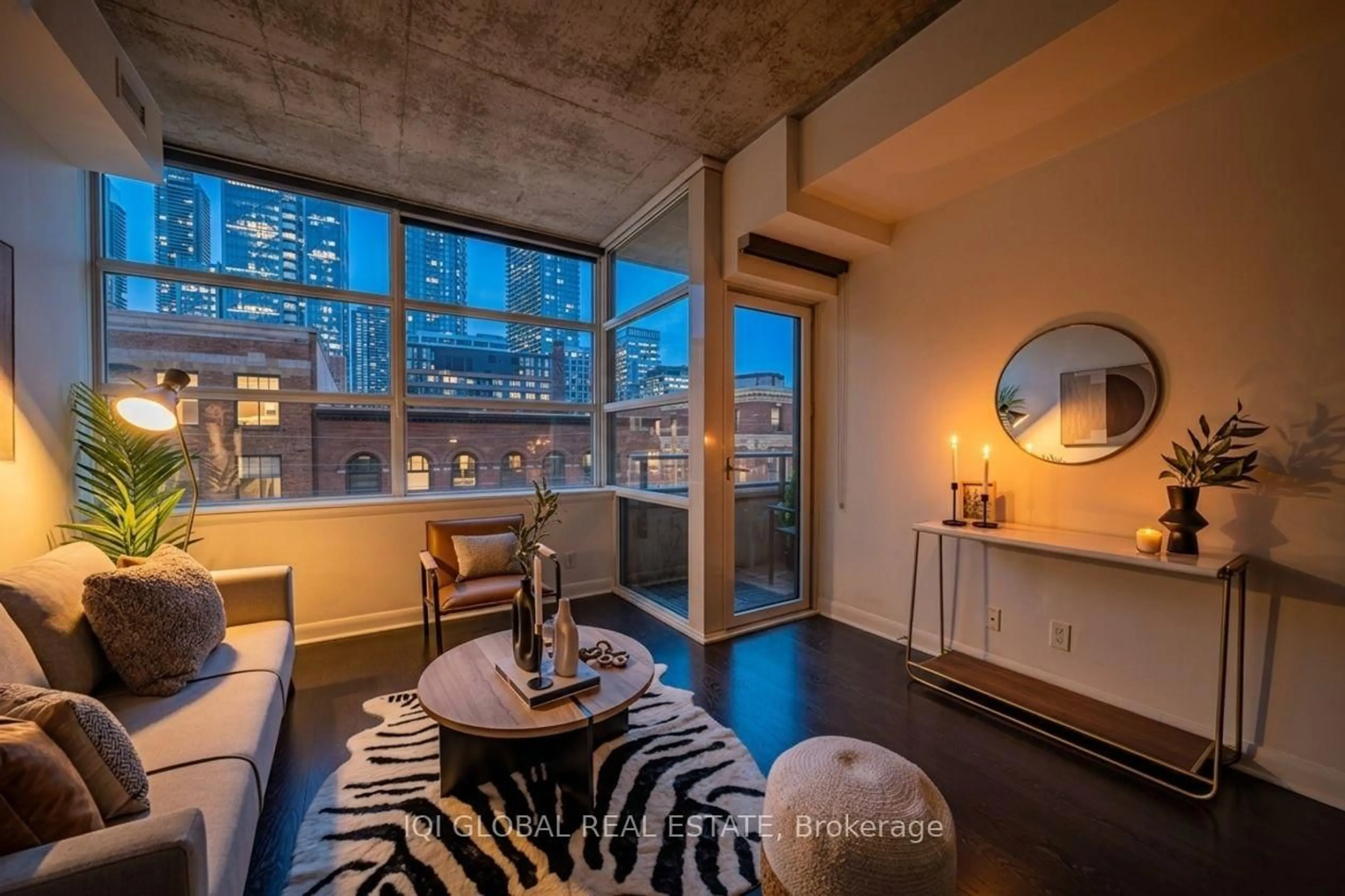 Living room with furniture, cement floor for 478 King St #406, Toronto Ontario M5V 0A8