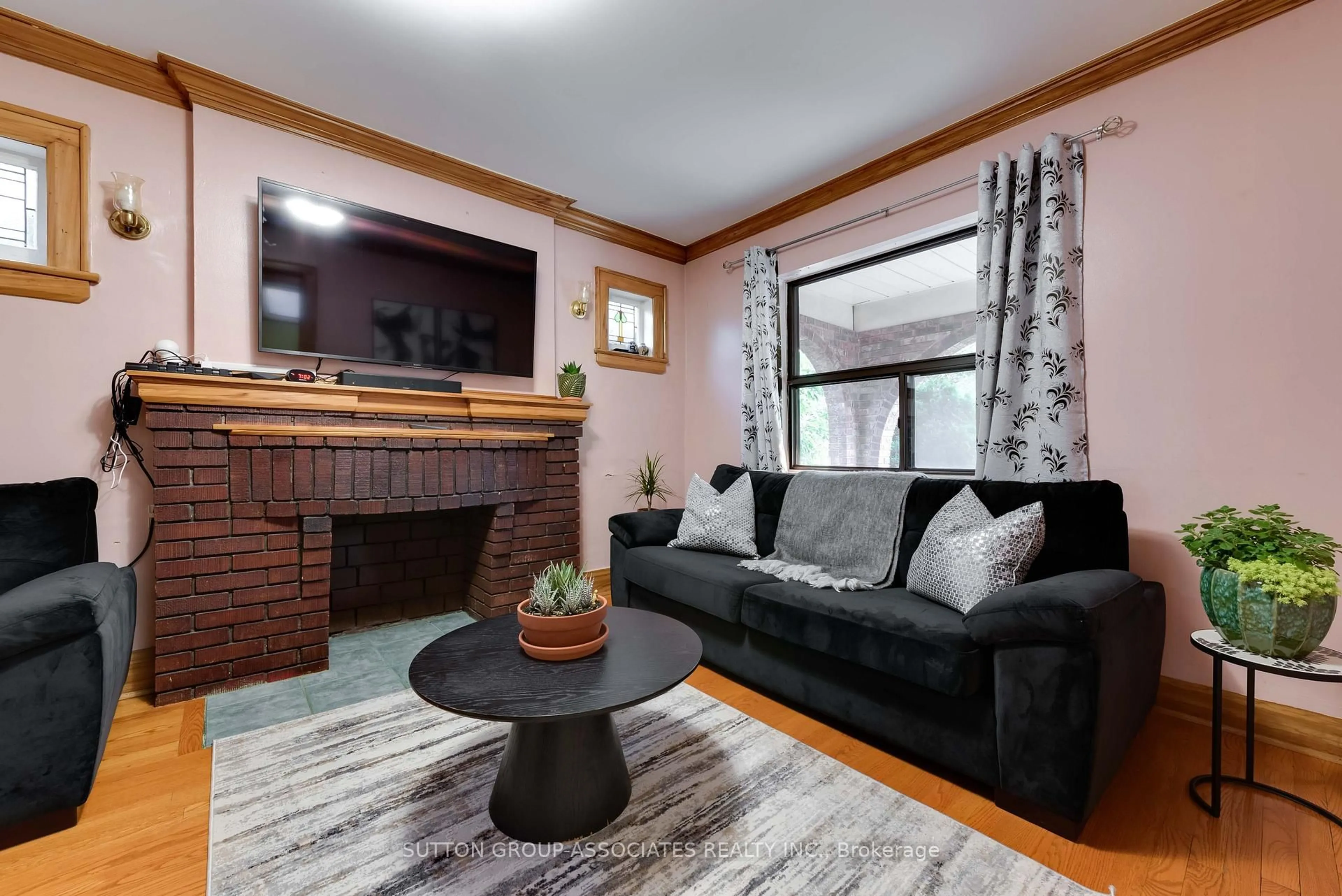 Living room with furniture, wood/laminate floor for 219 Atlas Ave, Toronto Ontario M6C 3P6