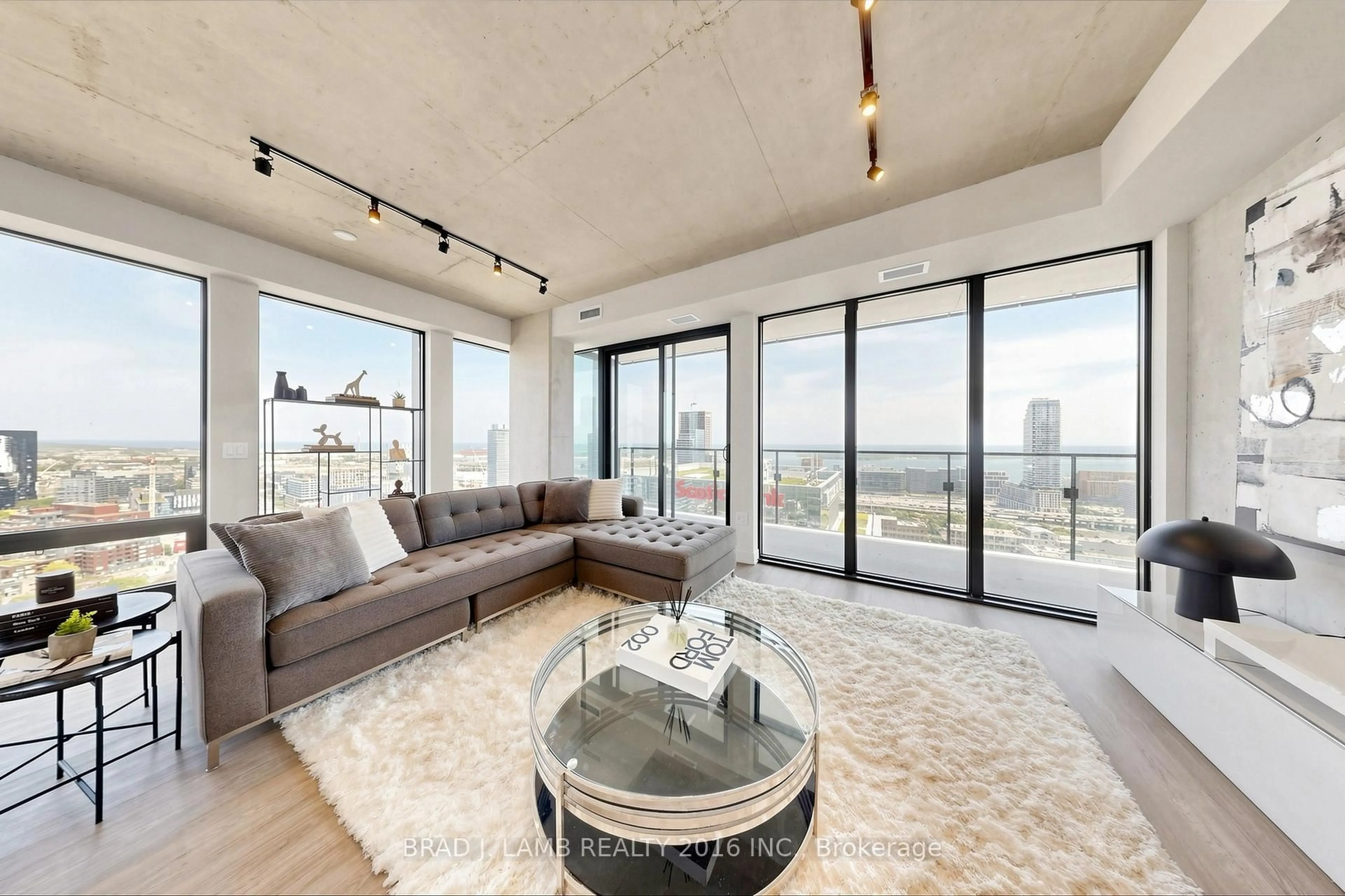 Living room with furniture, cement floor for 284 King St #2901, Toronto Ontario M5A 1K4