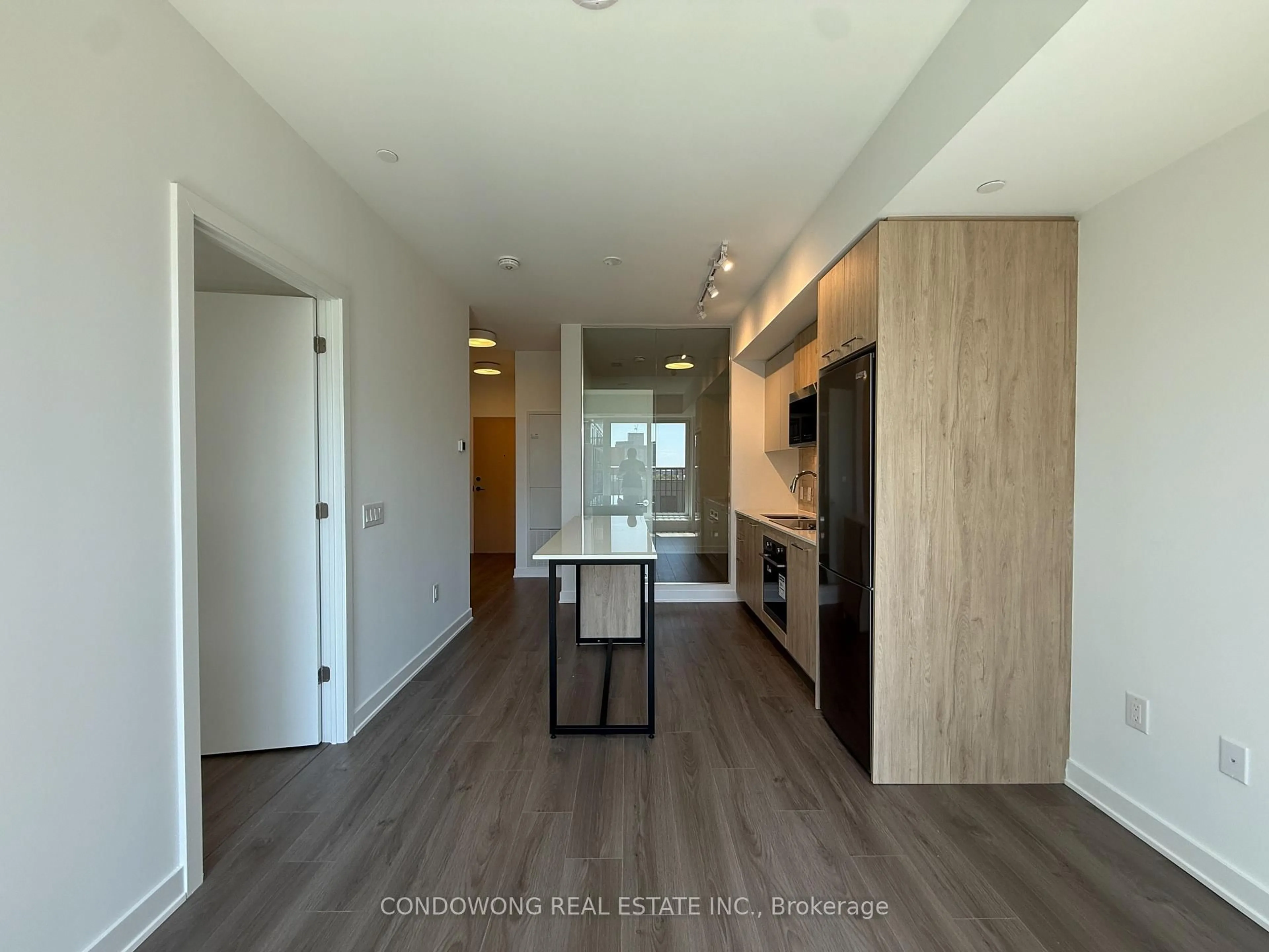 Open concept kitchen, wood/laminate floor for 30 Dreamers Way #714, Toronto Ontario M5A 0Y7