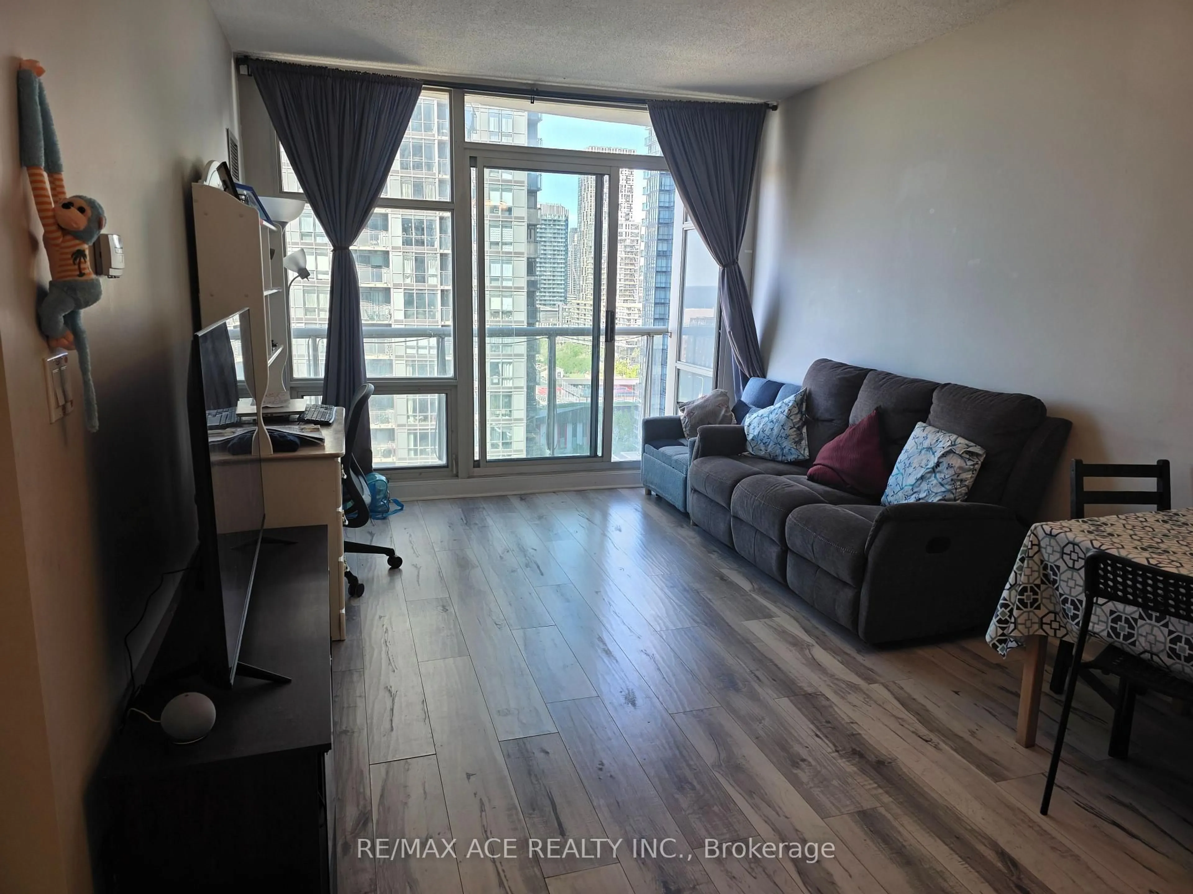Living room with furniture, wood/laminate floor for 35 Mariner Terr #1801, Toronto Ontario M5V 3V9