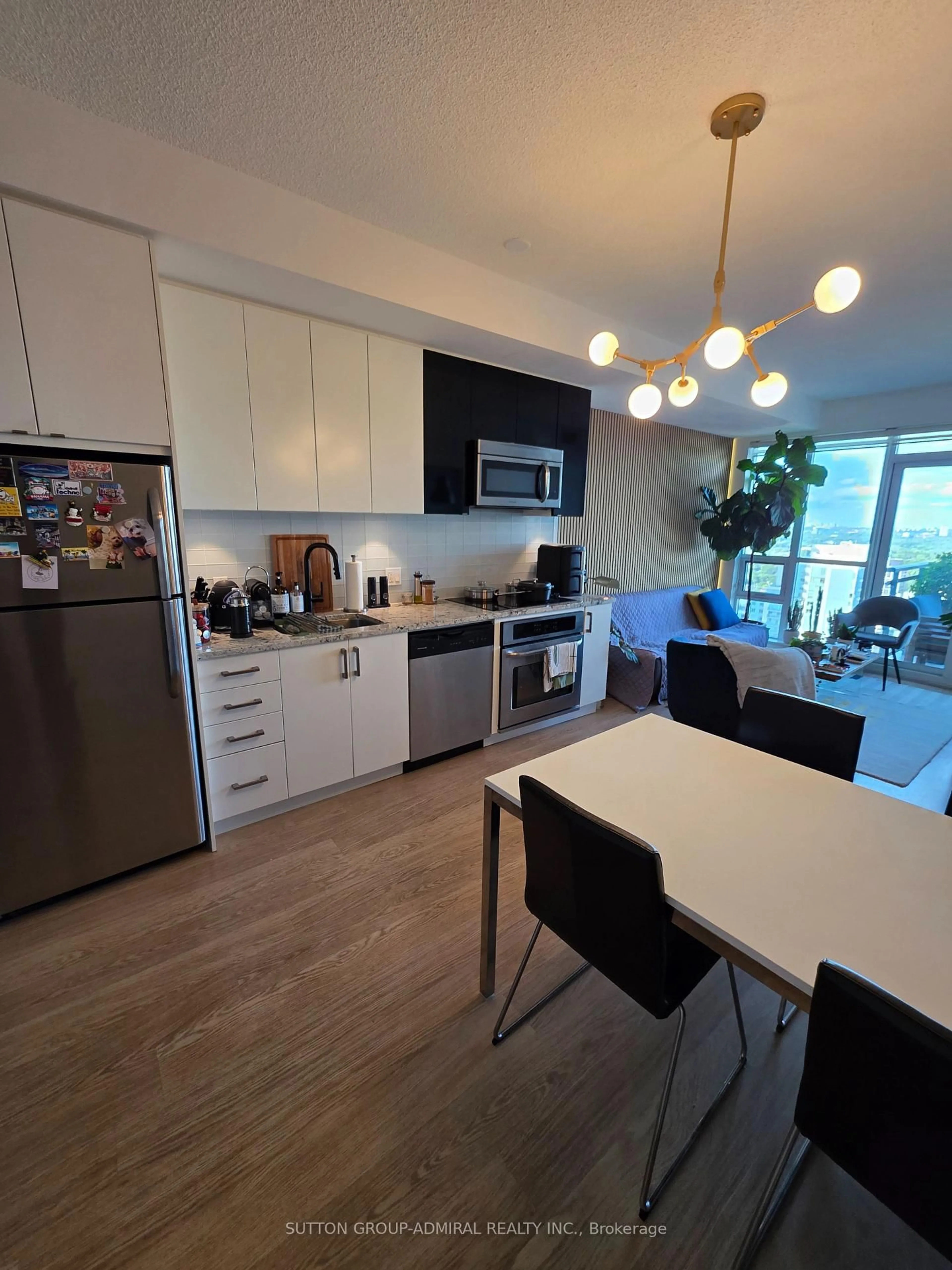 Open concept kitchen, wood/laminate floor for 98 Lillian St #2316, Toronto Ontario M4S 0A5