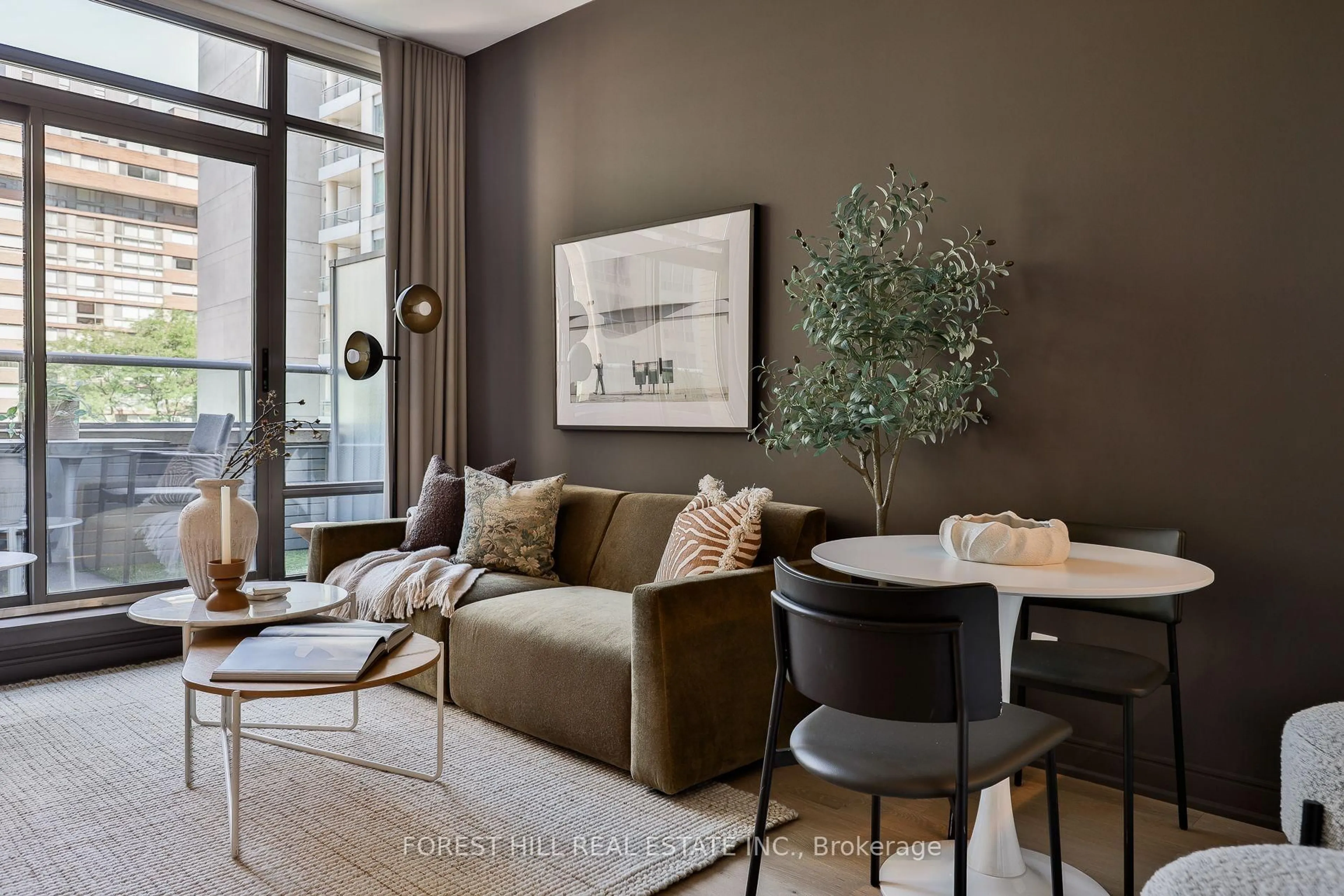 Living room with furniture, cement floor for 21 Scollard St #512, Toronto Ontario M5R 1G1