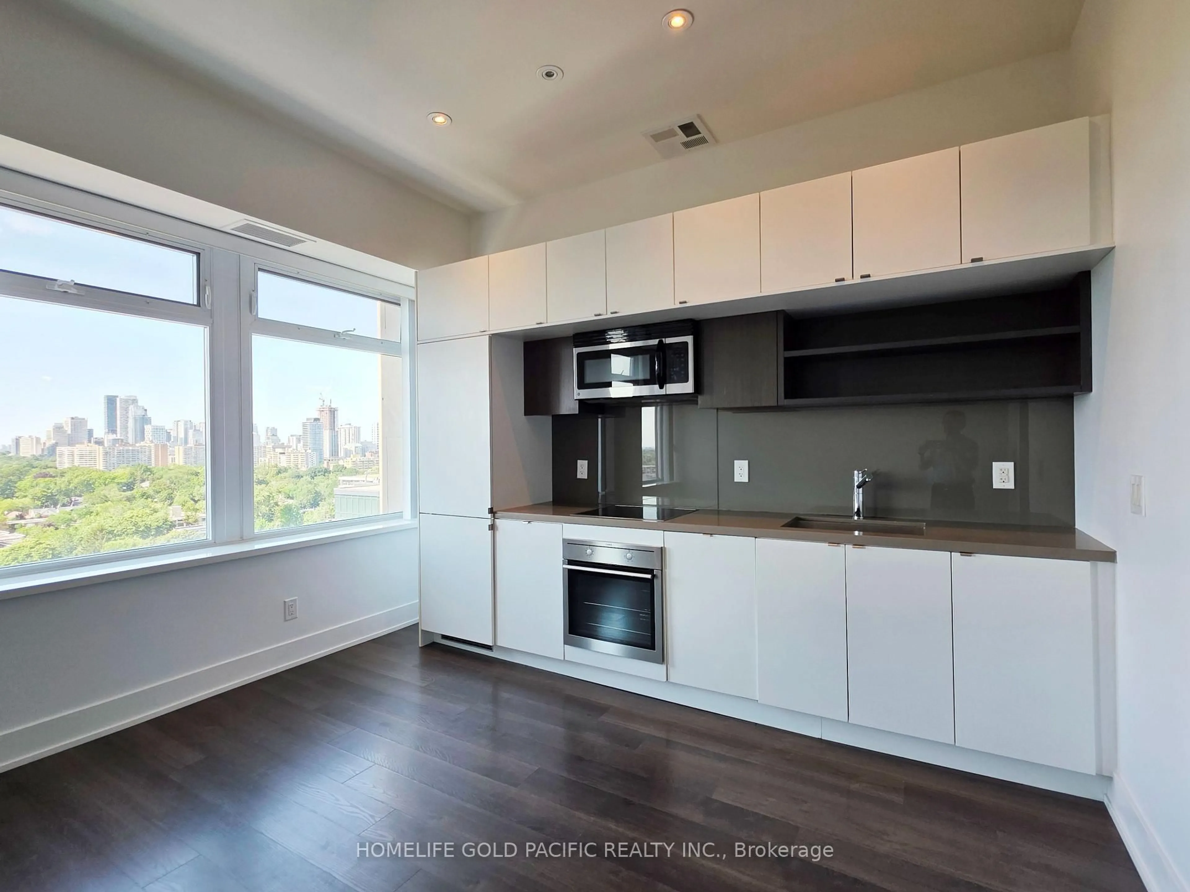 Open concept kitchen, wood/laminate floor for 111 St. Clair Ave #1222, Toronto Ontario M4V 1N5
