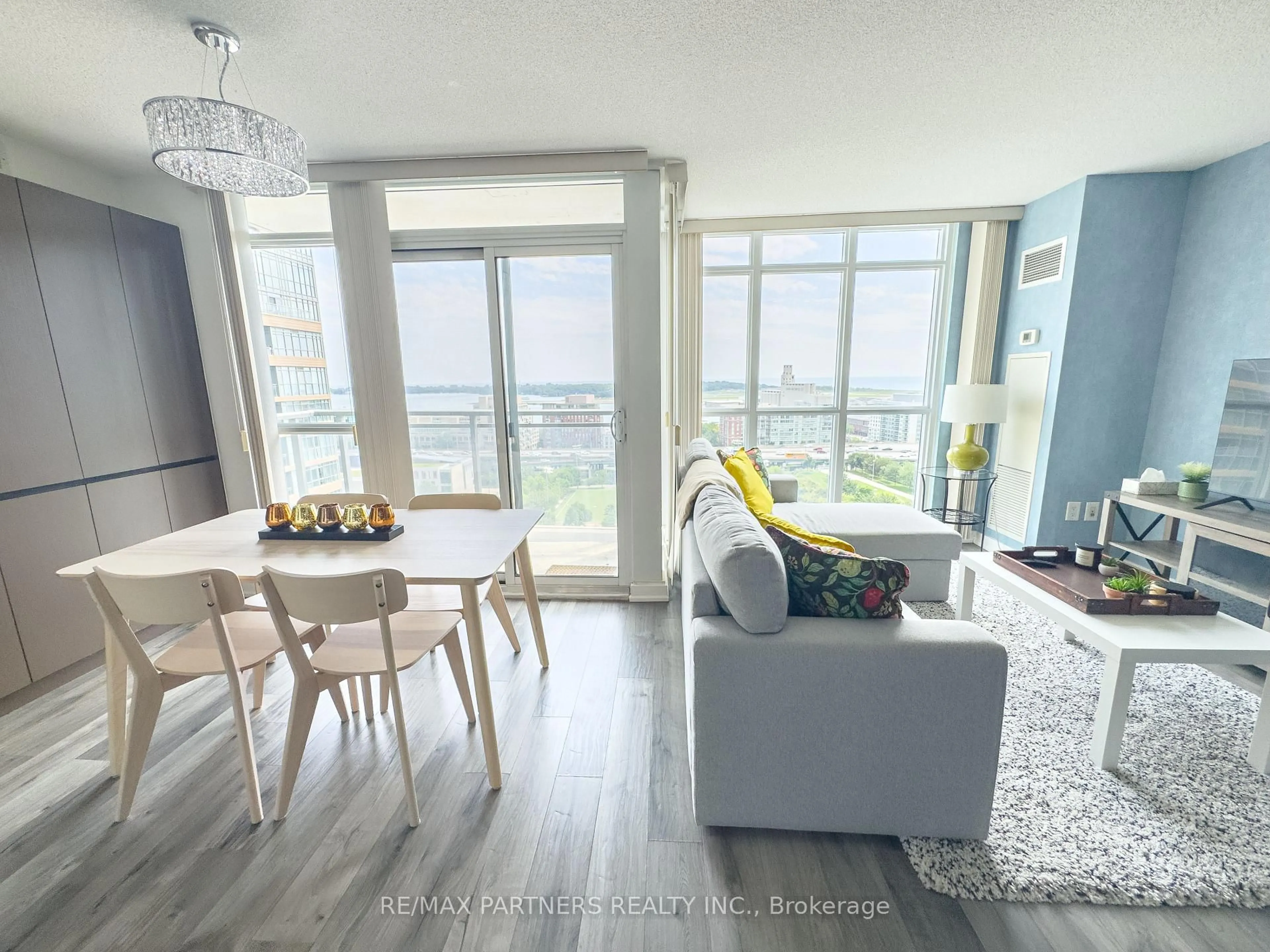 Living room with furniture, wood/laminate floor for 15 Iceboat Terr #1806, Toronto Ontario M5V 4A5