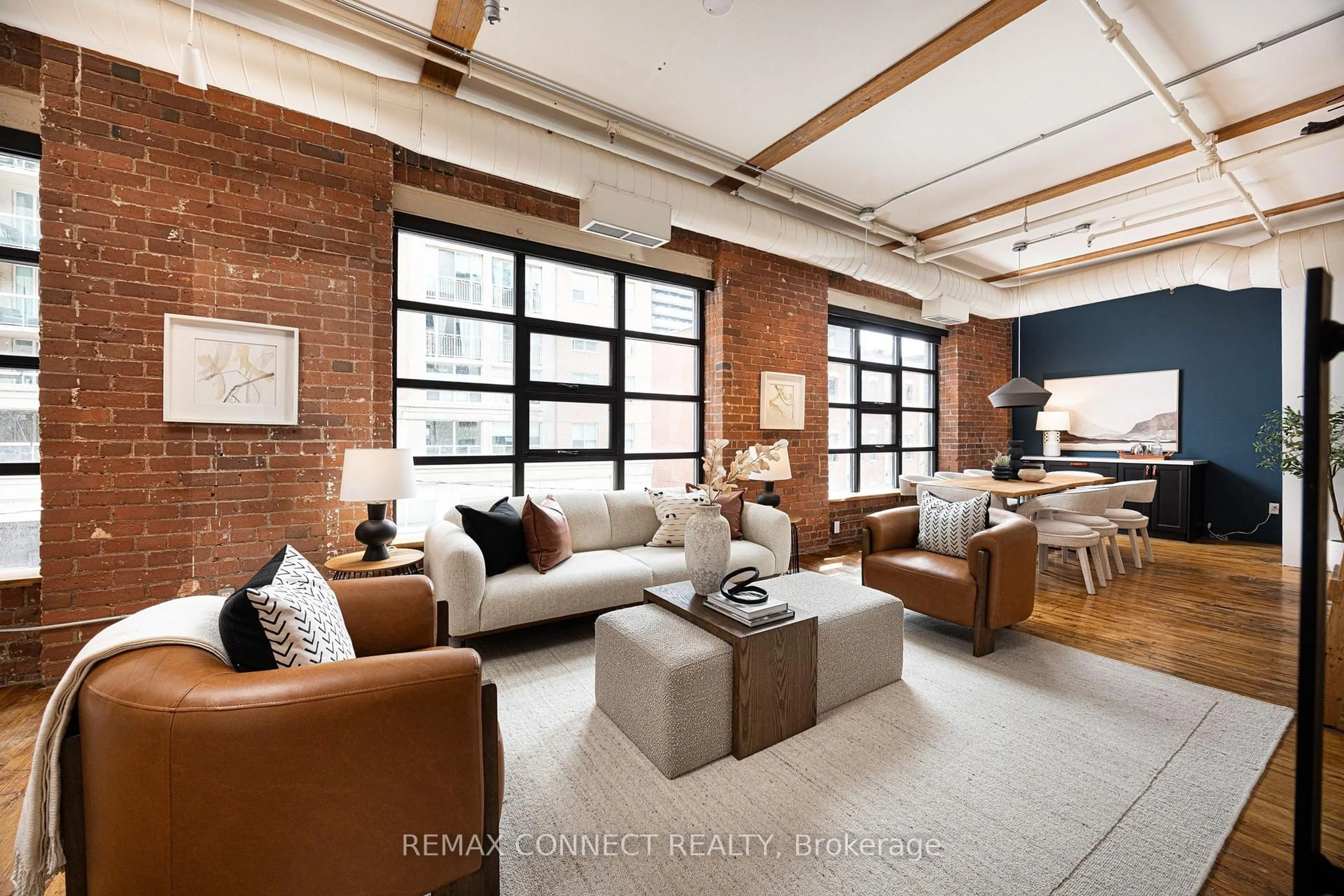 Living room with furniture, cement floor for 90 Sherbourne St #301, Toronto Ontario M5A 2R1