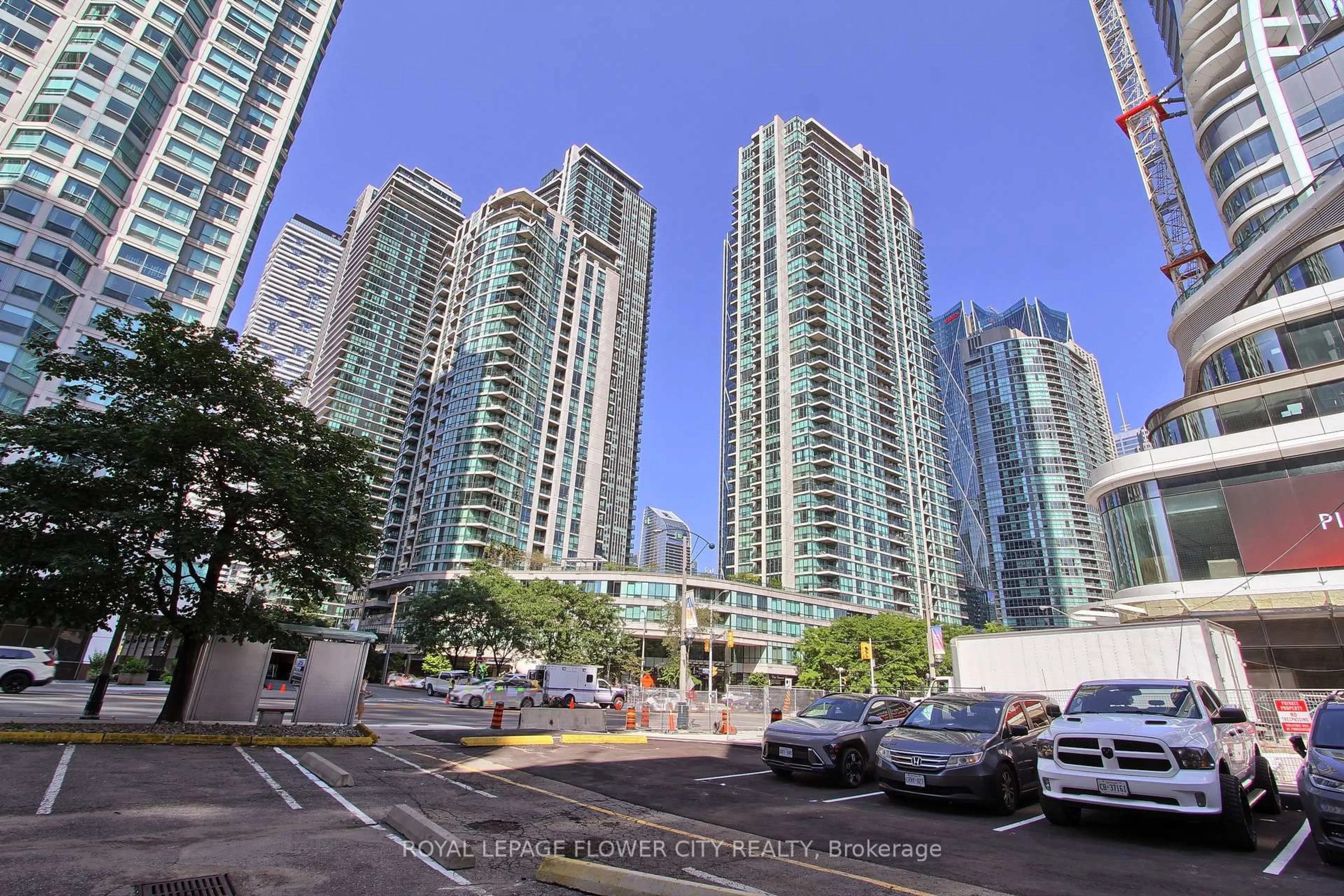A pic from outside/outdoor area/front of a property/back of a property/a pic from drone, city buildings view from balcony for 12 Yonge St #302, Toronto Ontario M5M 3G5