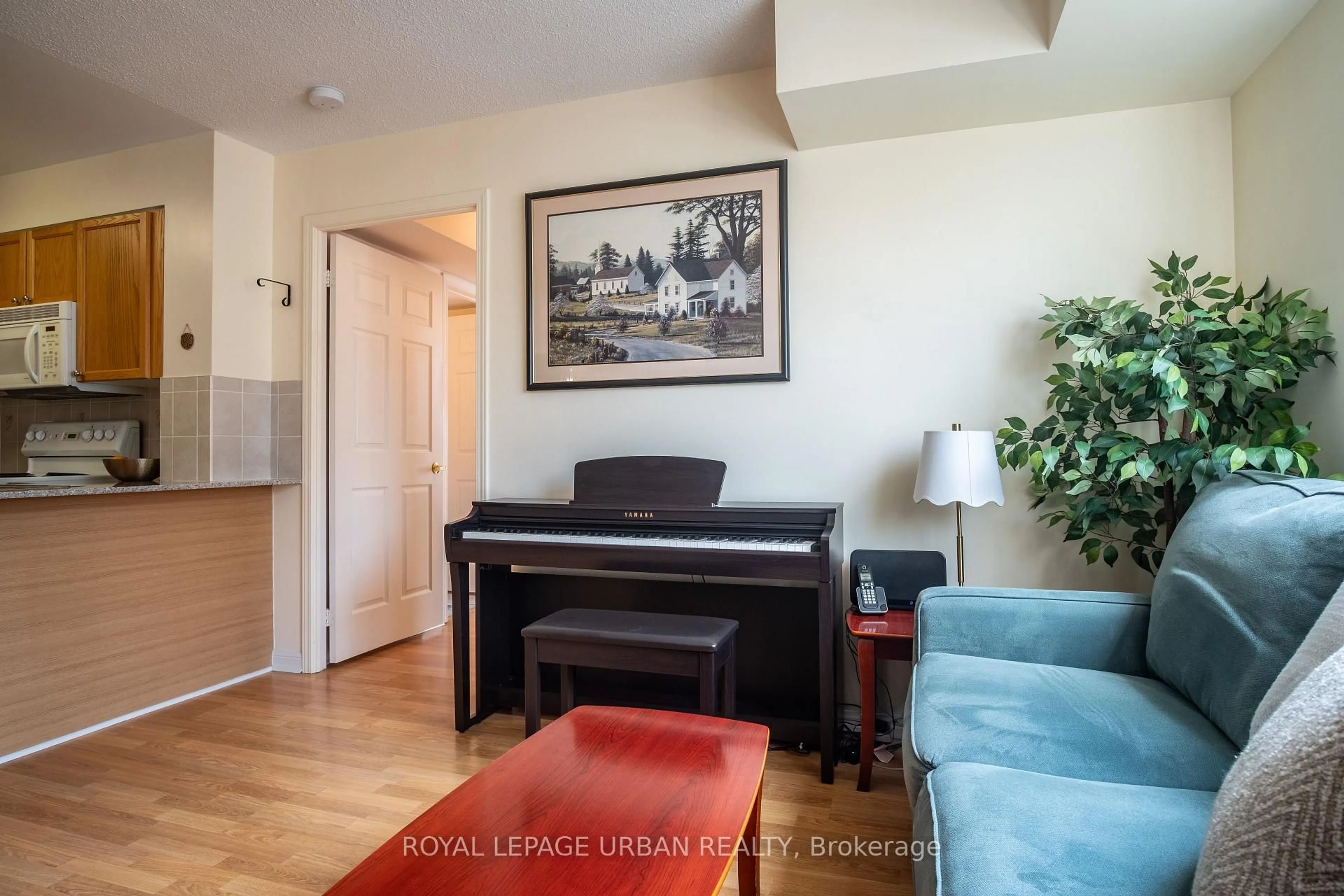 Living room with furniture, wood/laminate floor for 5940 Yonge St #201, Toronto Ontario M2M 4M6