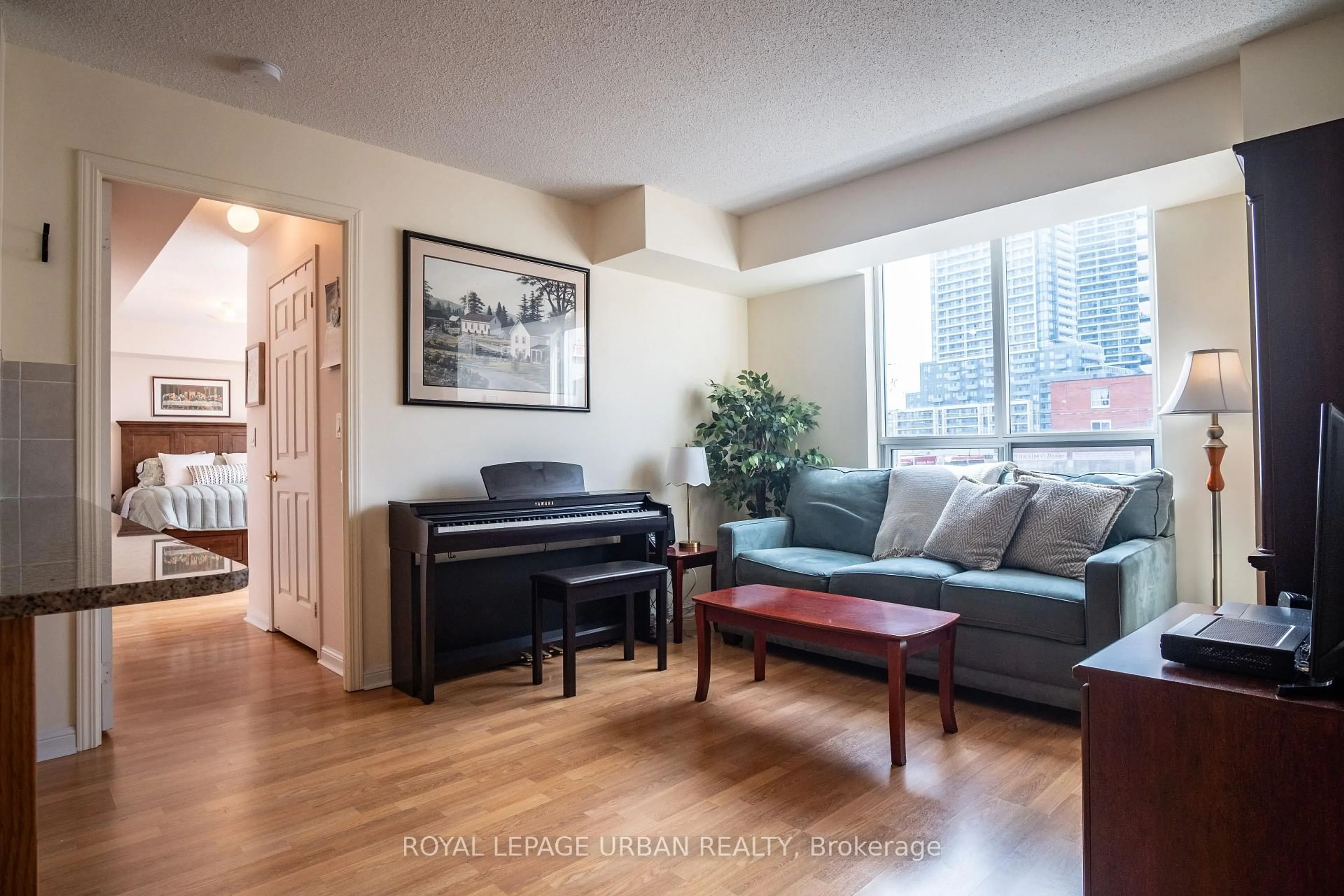 Living room with furniture, wood/laminate floor for 5940 Yonge St #201, Toronto Ontario M2M 4M6
