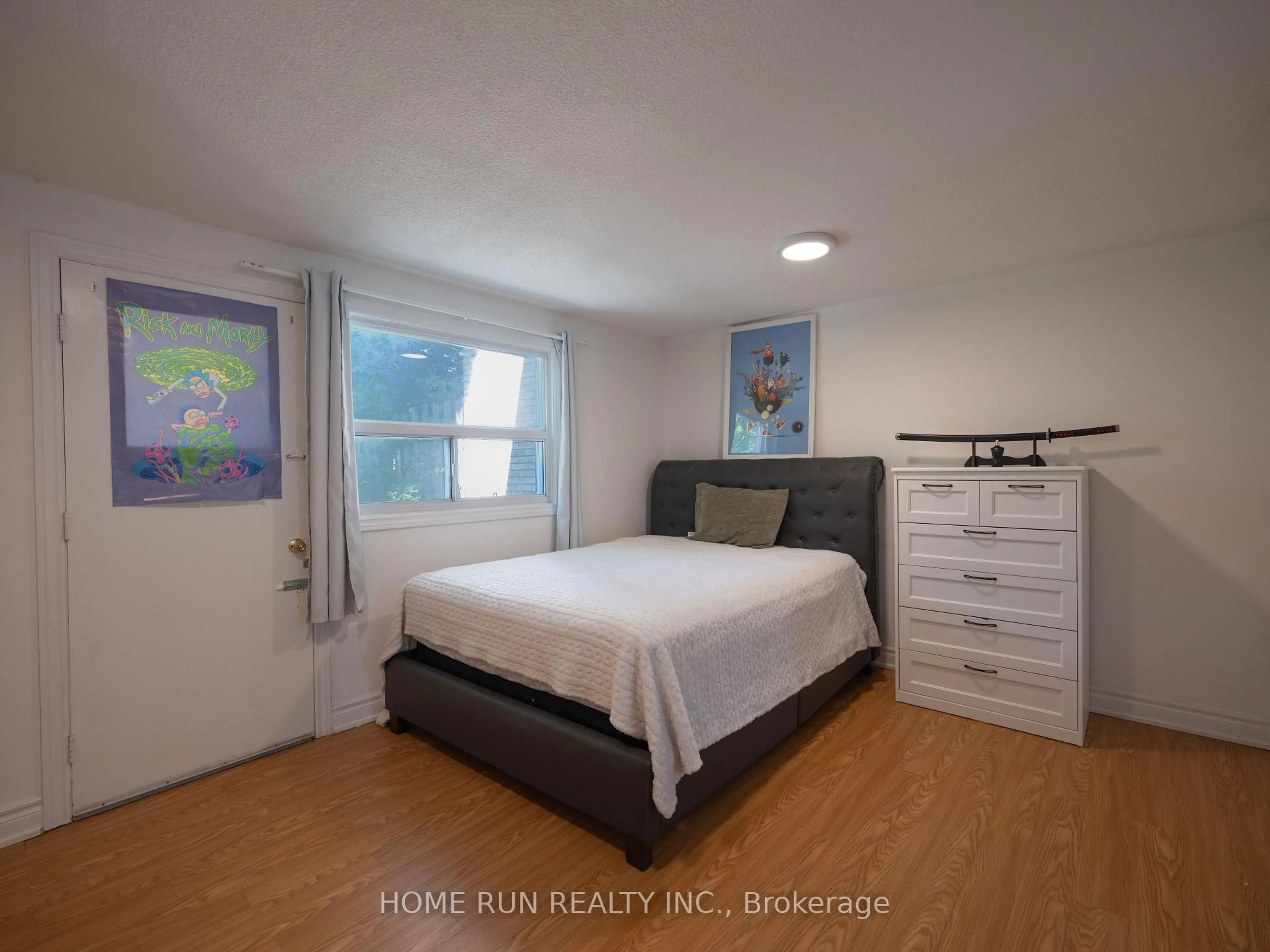 Bedroom with bed, wood/laminate floor for 119 Courville Coachway Way #55, Toronto Ontario M2J 3V6