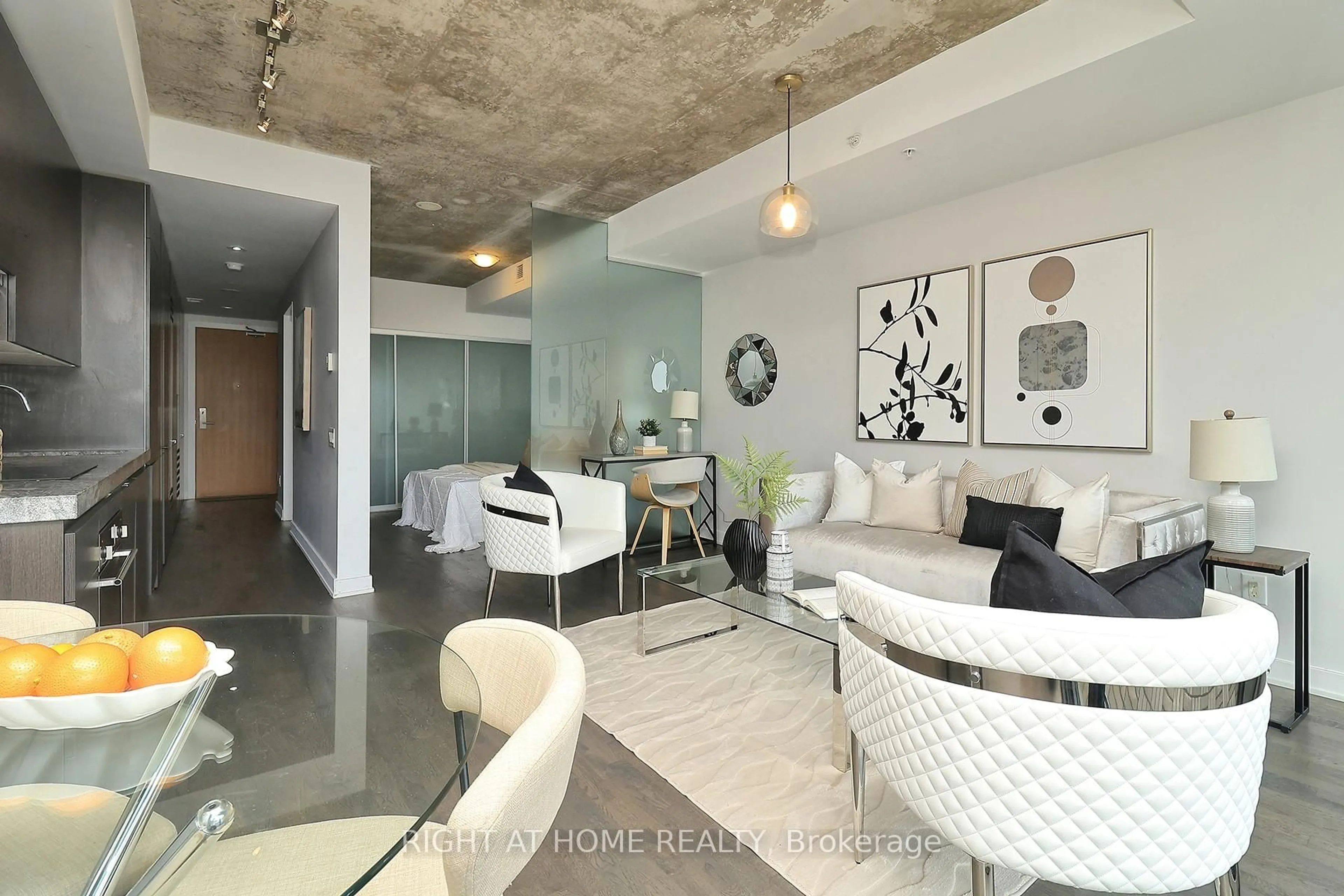 Living room with furniture, cement floor for 629 King St #1112, Toronto Ontario M5V 0G9