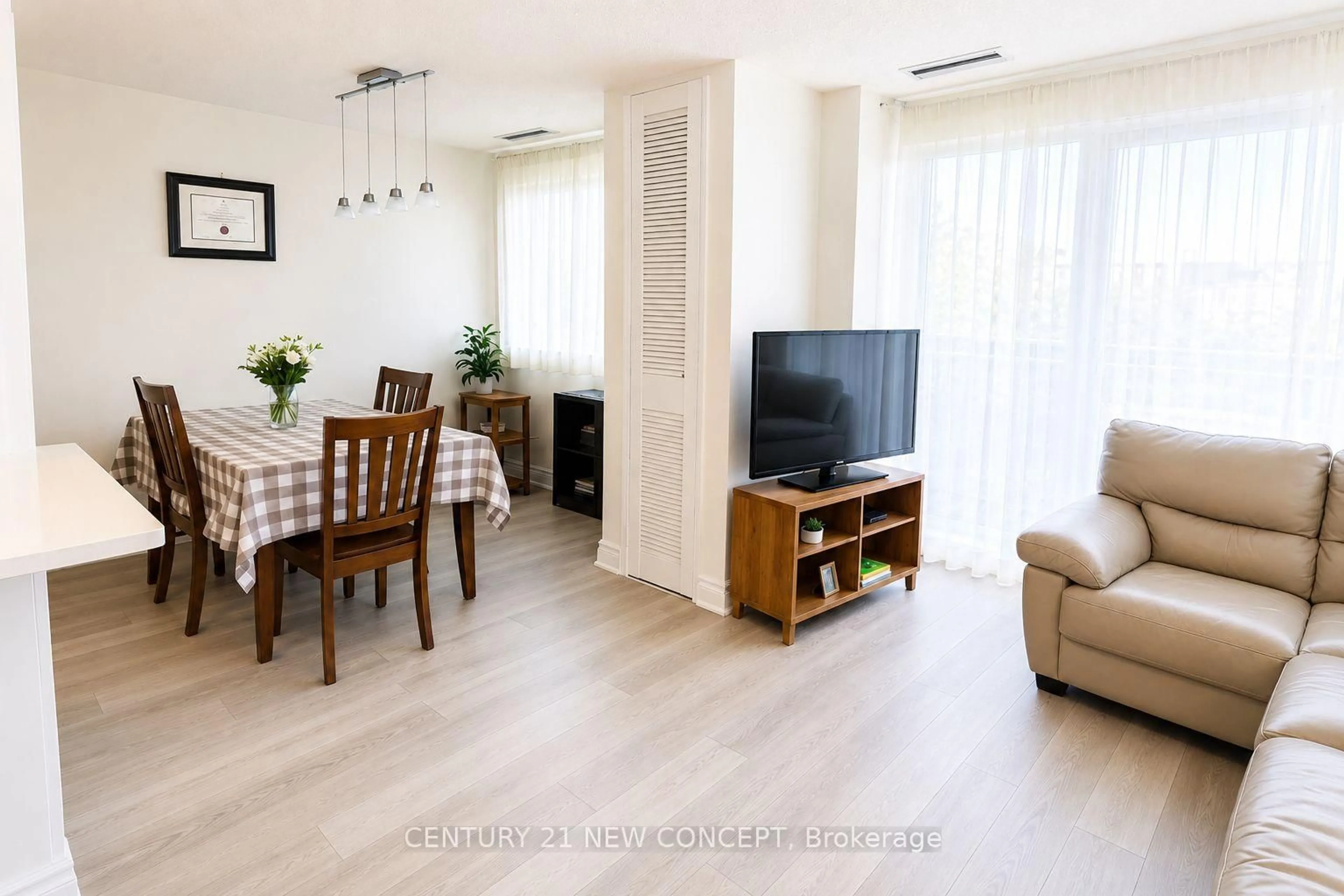 Living room with furniture, wood/laminate floor for 4005 Don Mills Rd #344, Toronto Ontario M2H 3J9