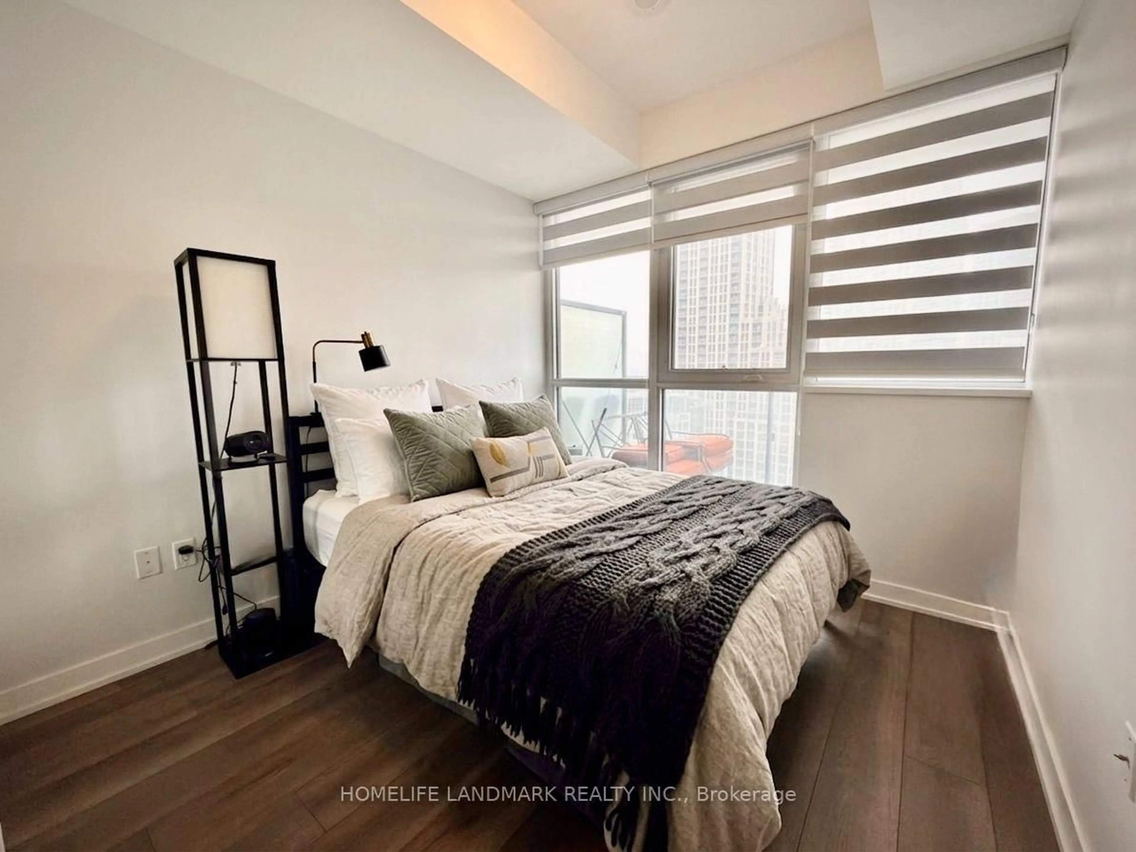 Bedroom with bed, wood/laminate floor for 38 Iannuzzi St #1701, Toronto Ontario M5V 0S2