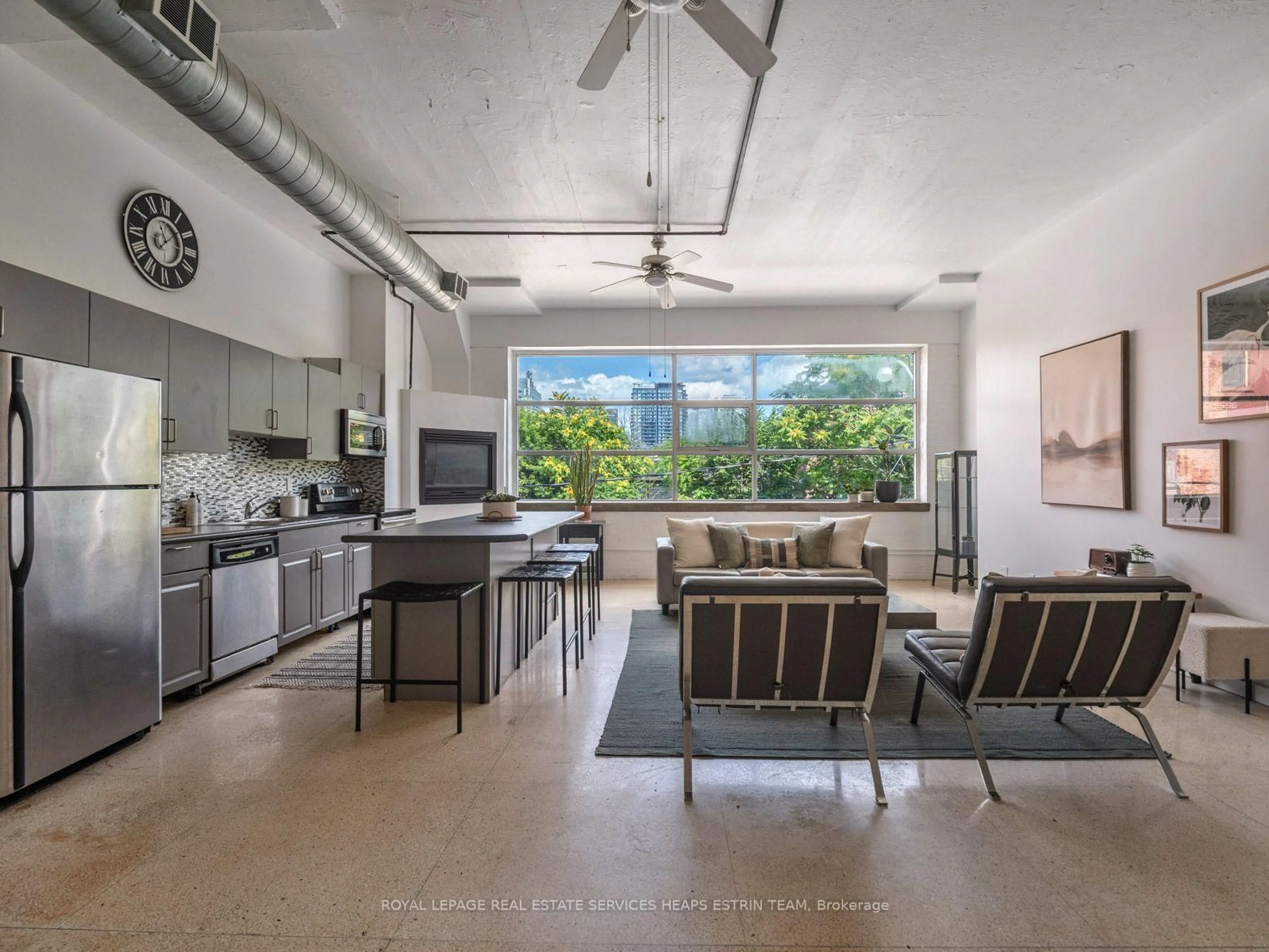 Open concept kitchen, cement floor for 365 Dundas St #207, Toronto Ontario M5A 4R9