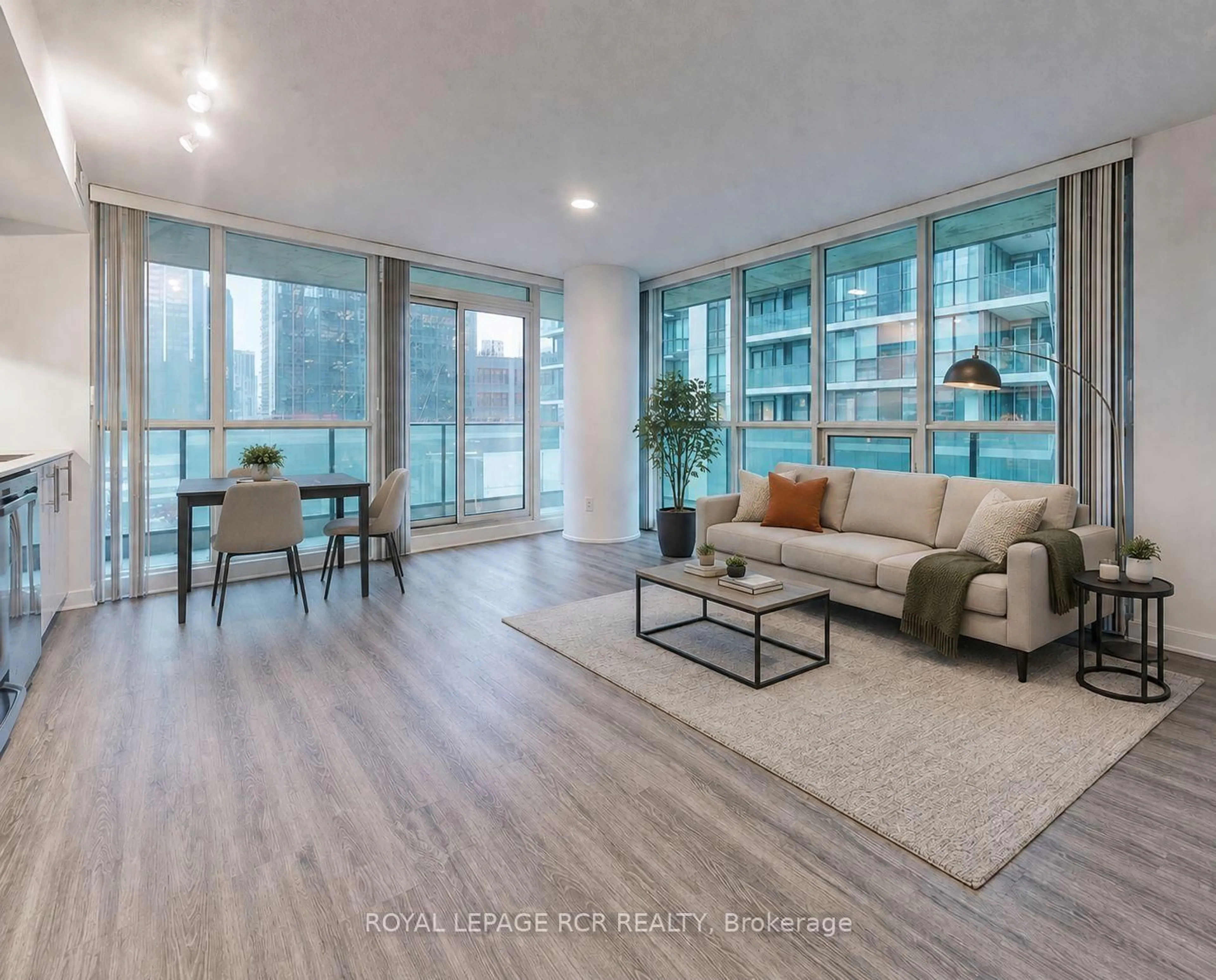 Living room with furniture, wood/laminate floor for 33 Bay St #904, Toronto Ontario M5J 2Z3