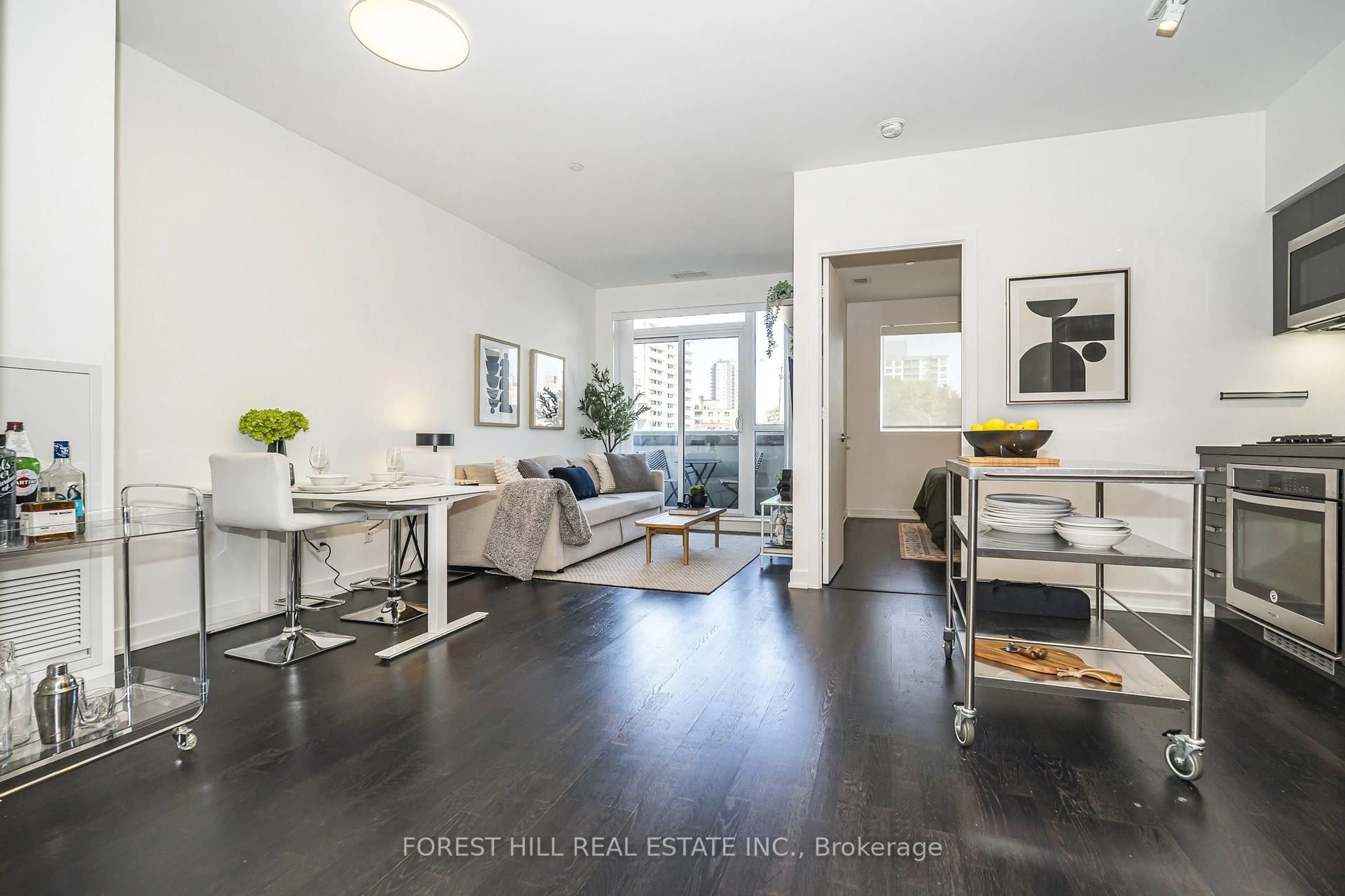 Living room with furniture, wood/laminate floor for 501 St Clair Ave #202, Toronto Ontario M5P 0A2