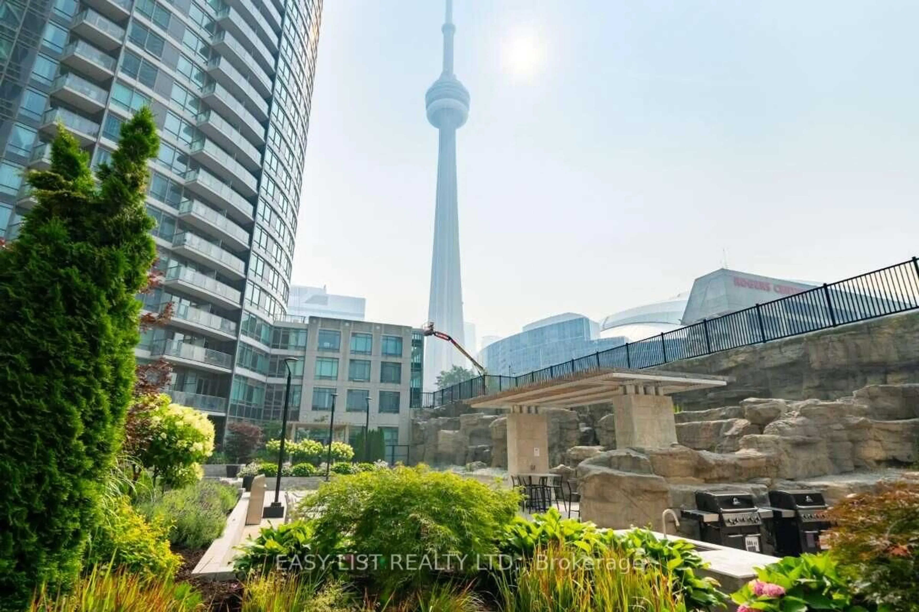 Patio, city buildings view from balcony for 373 Front St #101, Toronto Ontario M5V 3R7