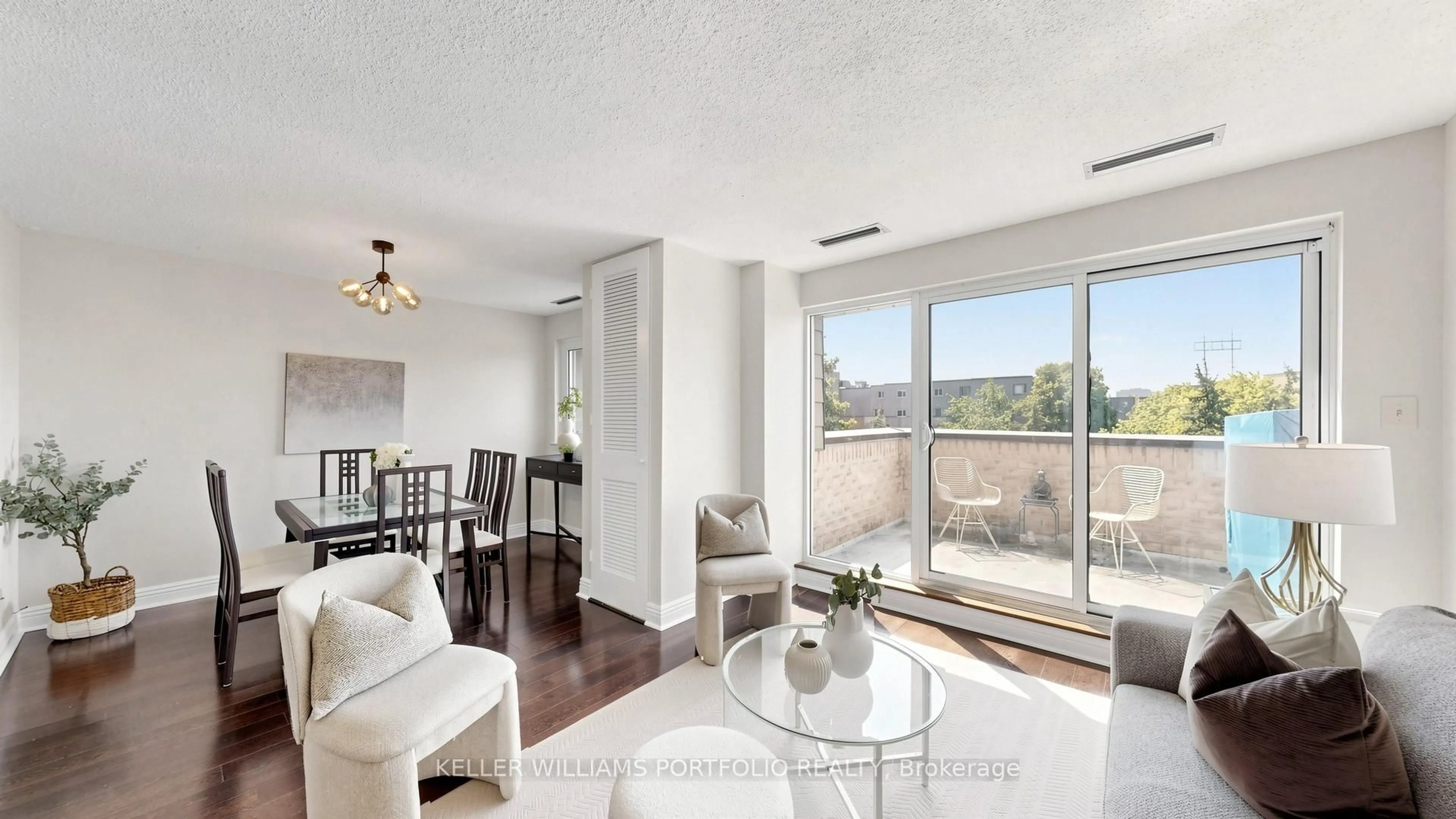 Living room with furniture, wood/laminate floor for 4005 Don Mills Rd #358, Toronto Ontario M2H 3J9