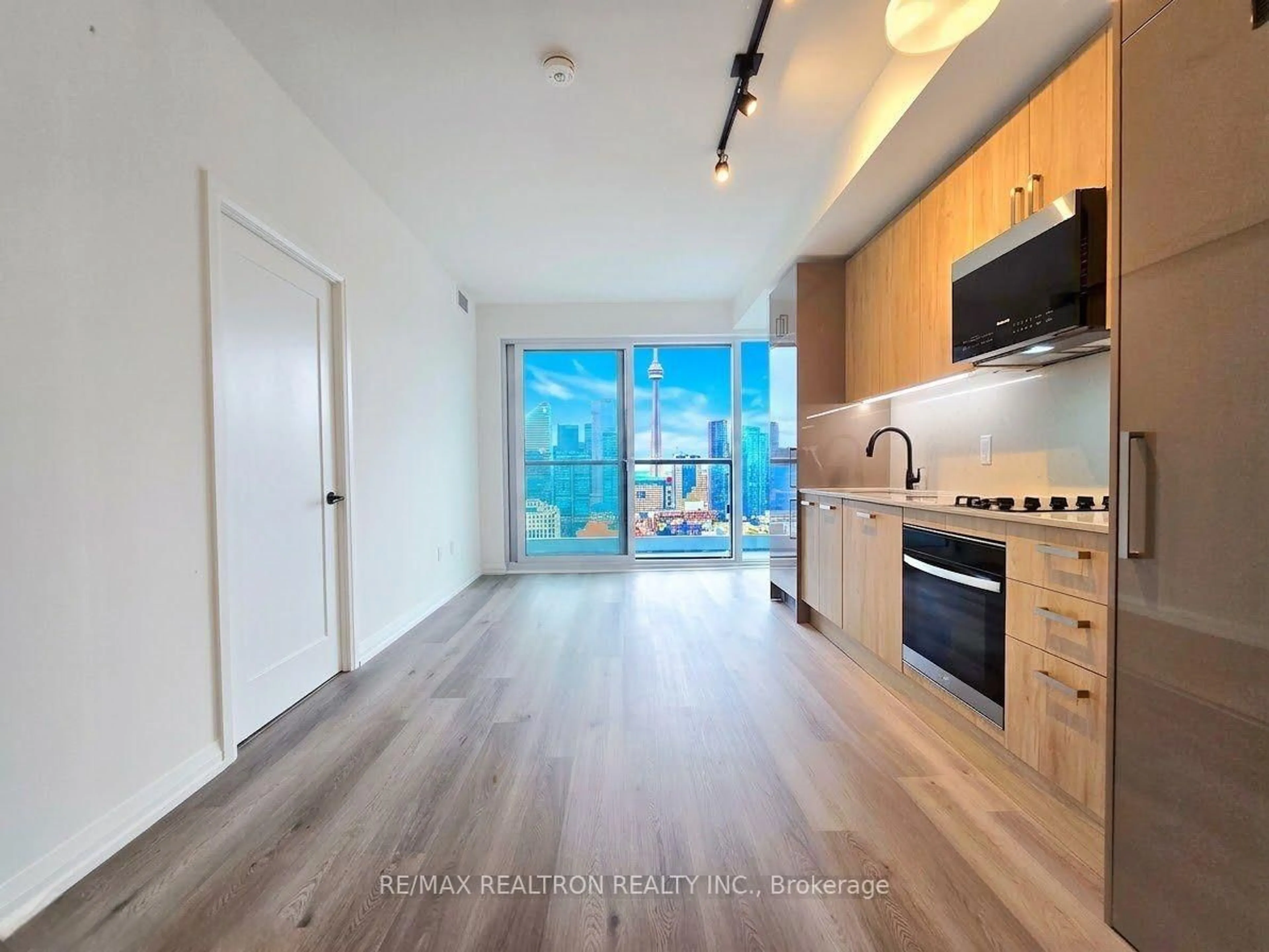 Open concept kitchen, wood/laminate floor for 280 Dundas St #2509, Toronto Ontario M5T 0E3