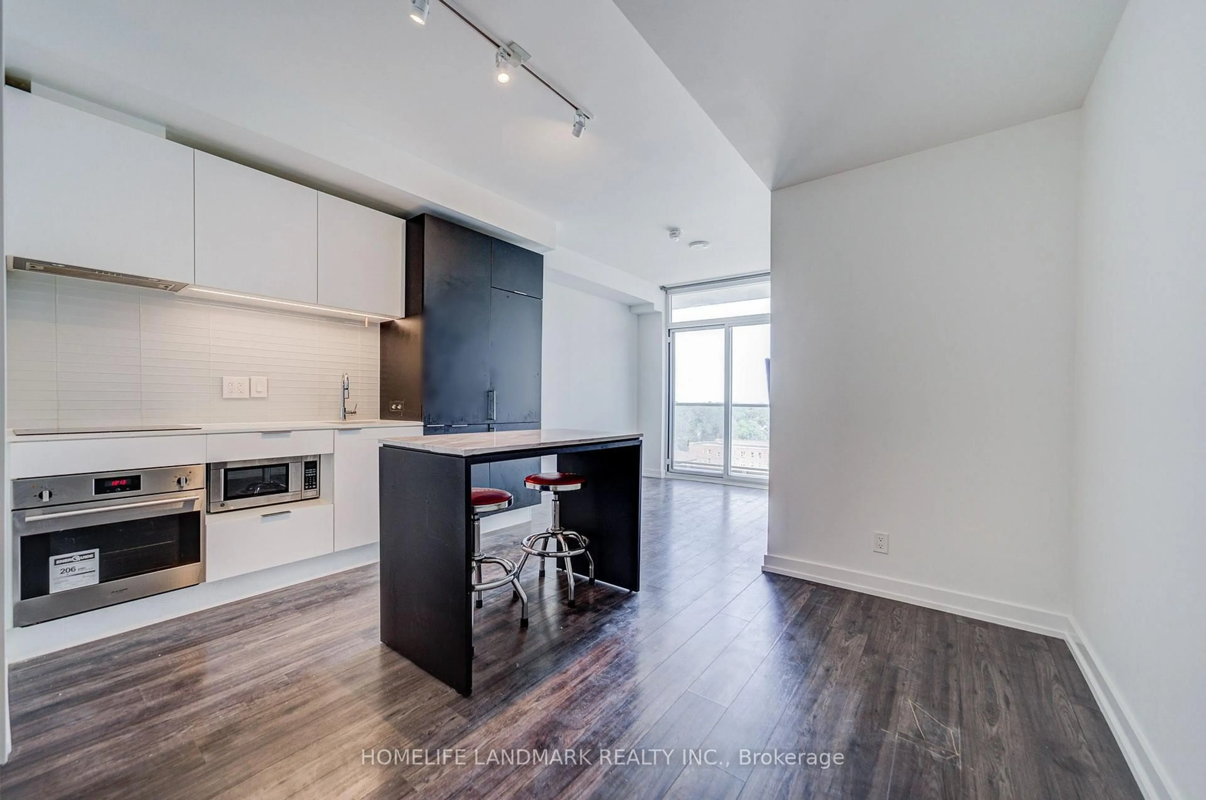 Open concept kitchen, wood/laminate floor for 33 Helendale Ave #601, Toronto Ontario M4R 0A4