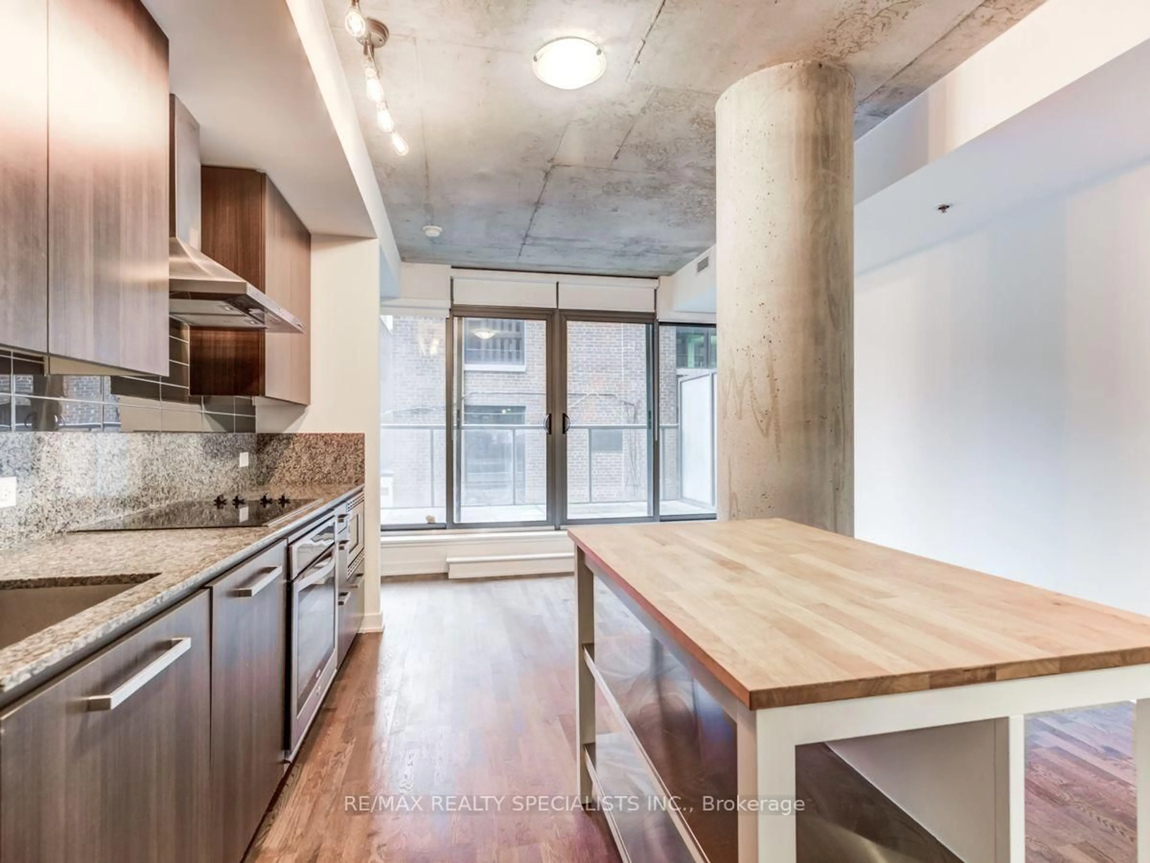 Open concept kitchen, cement floor for 15 Beverley St #304, Toronto Ontario M5T 1X8