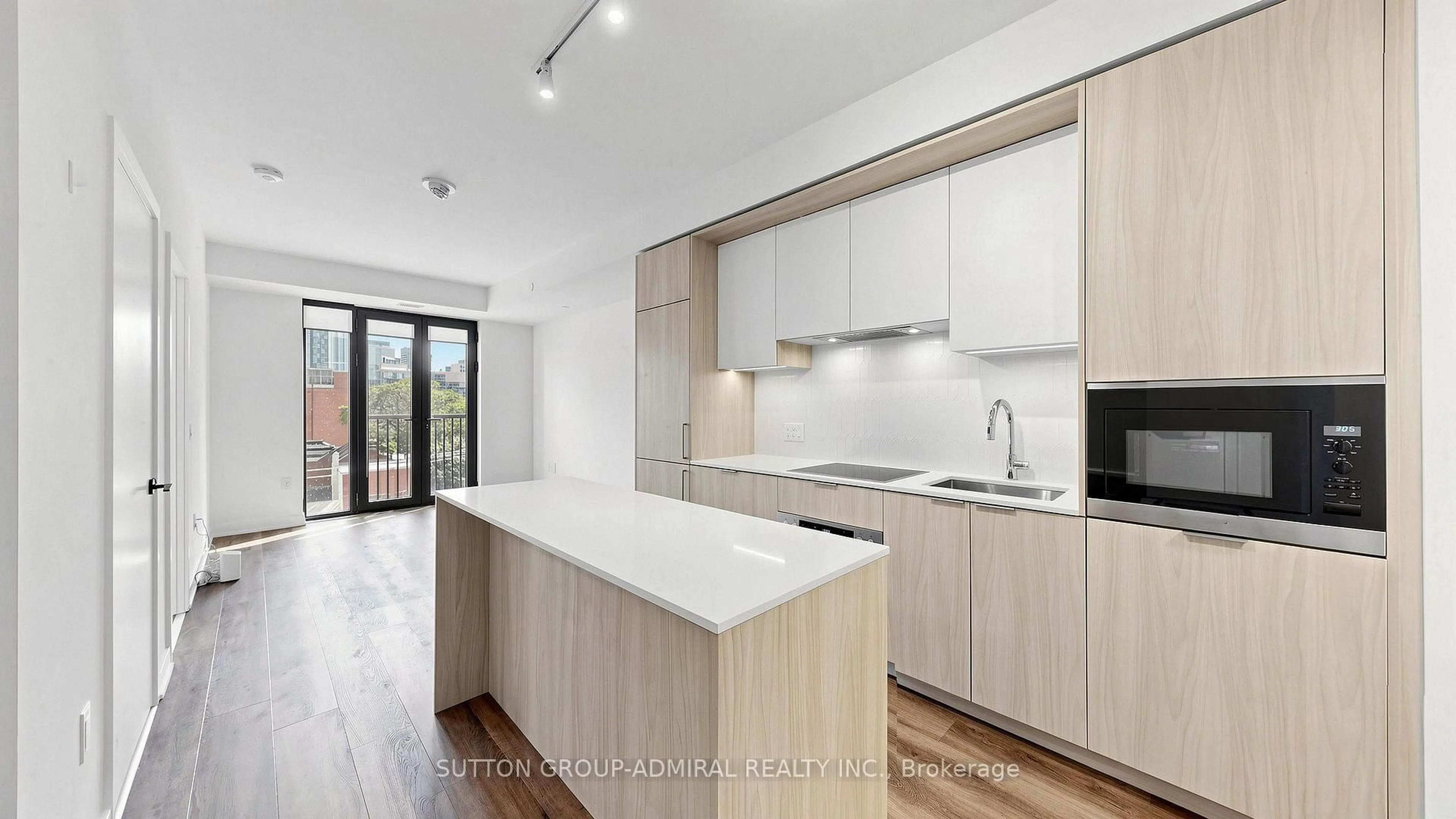 Open concept kitchen, wood/laminate floor for 123 Portland St #409, Toronto Ontario M5V 2N4