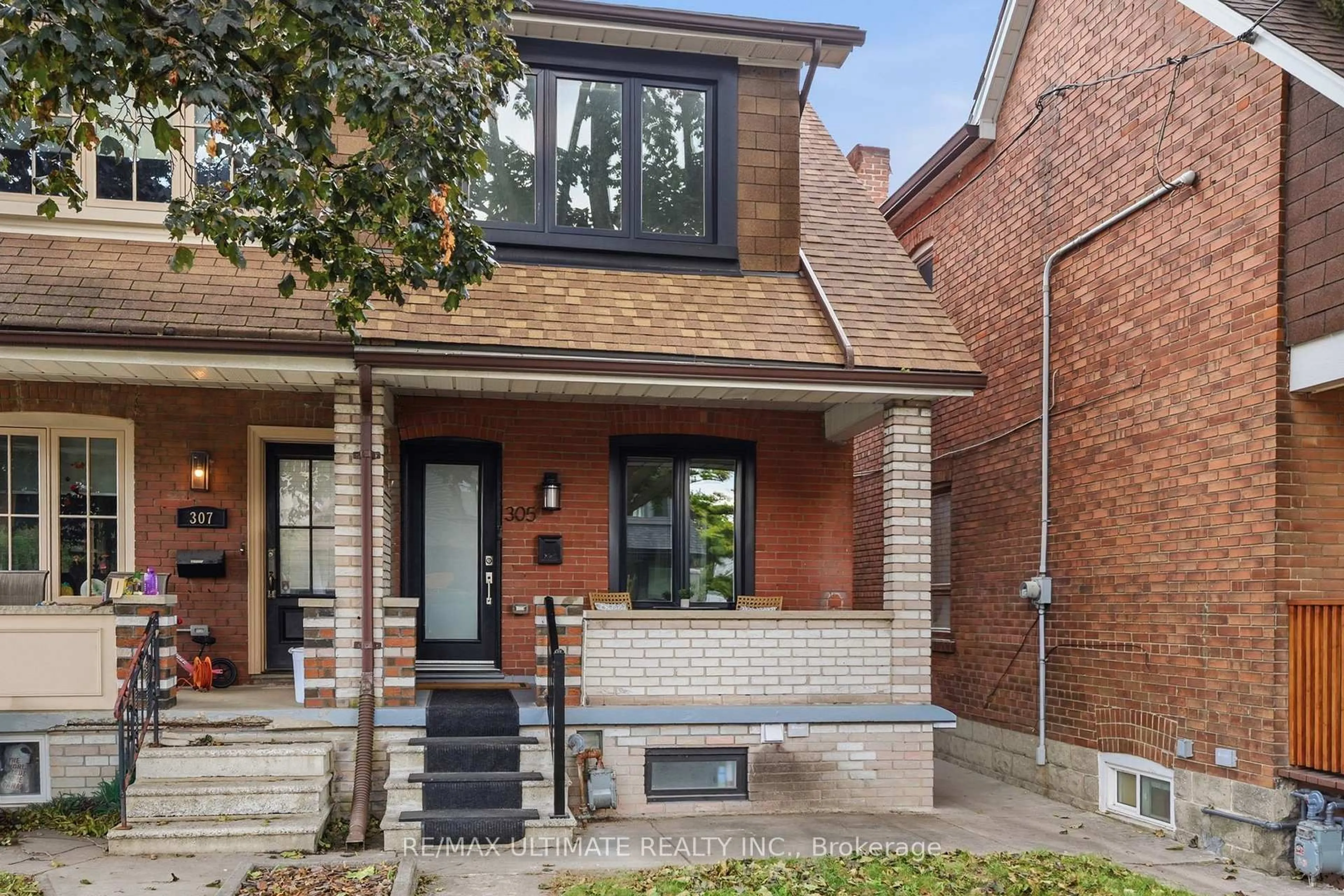 Home with brick exterior material, street for 305 Winona Dr, Toronto Ontario M6C 3S8