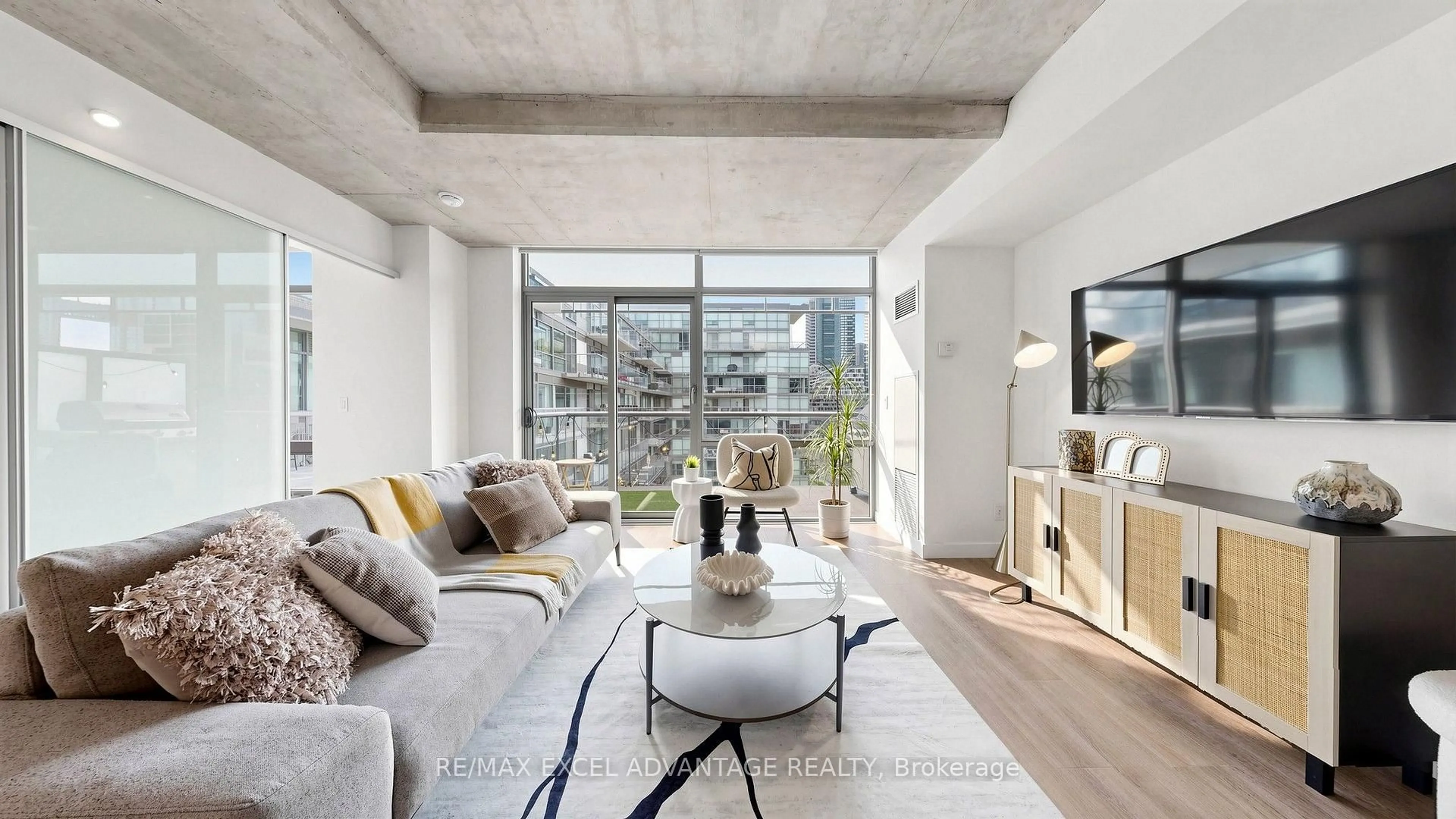 Living room with furniture, cement floor for 55 Stewart St #829, Toronto Ontario M5V 2V1