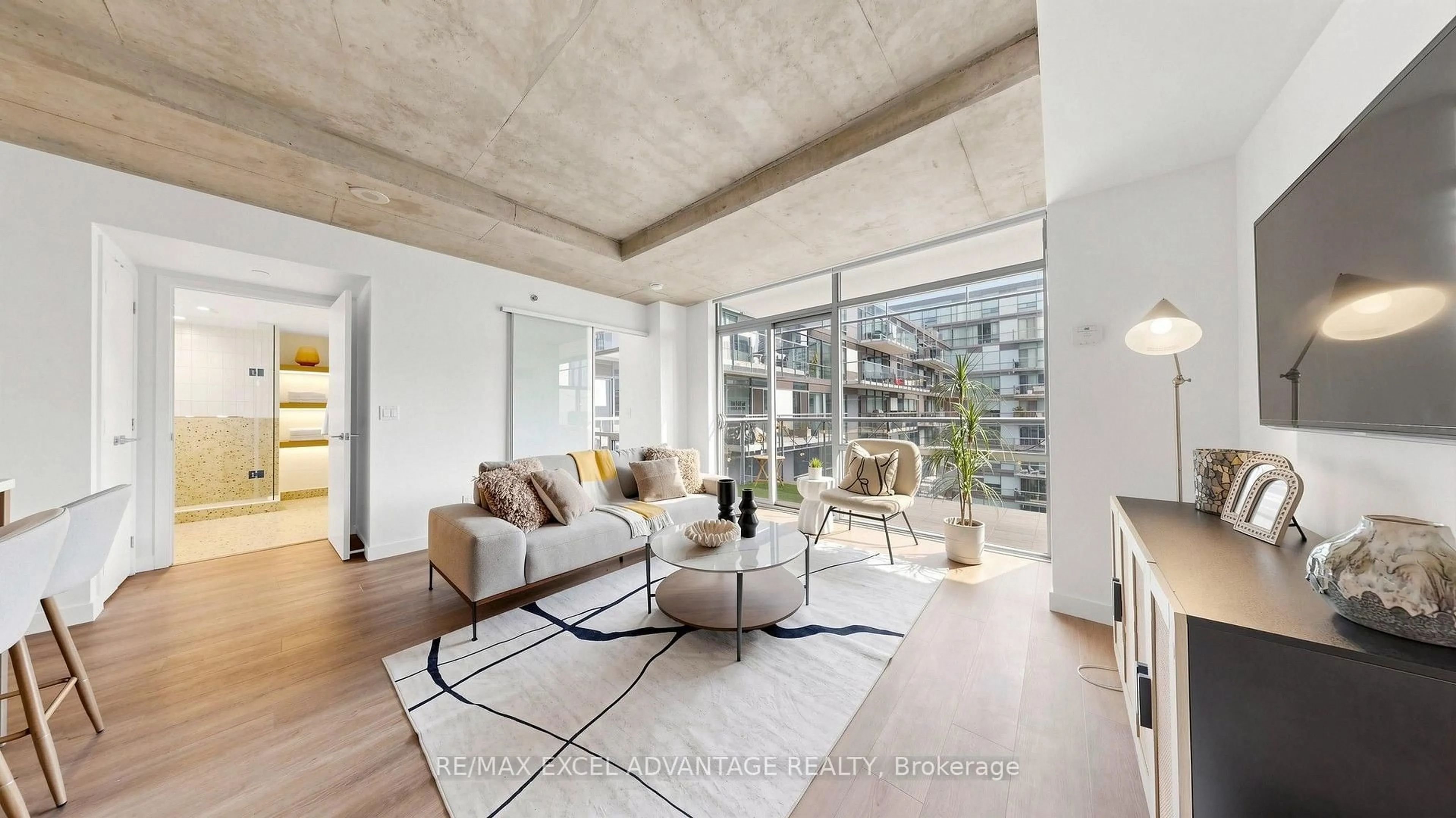 Living room with furniture, cement floor for 55 Stewart St #829, Toronto Ontario M5V 2V1