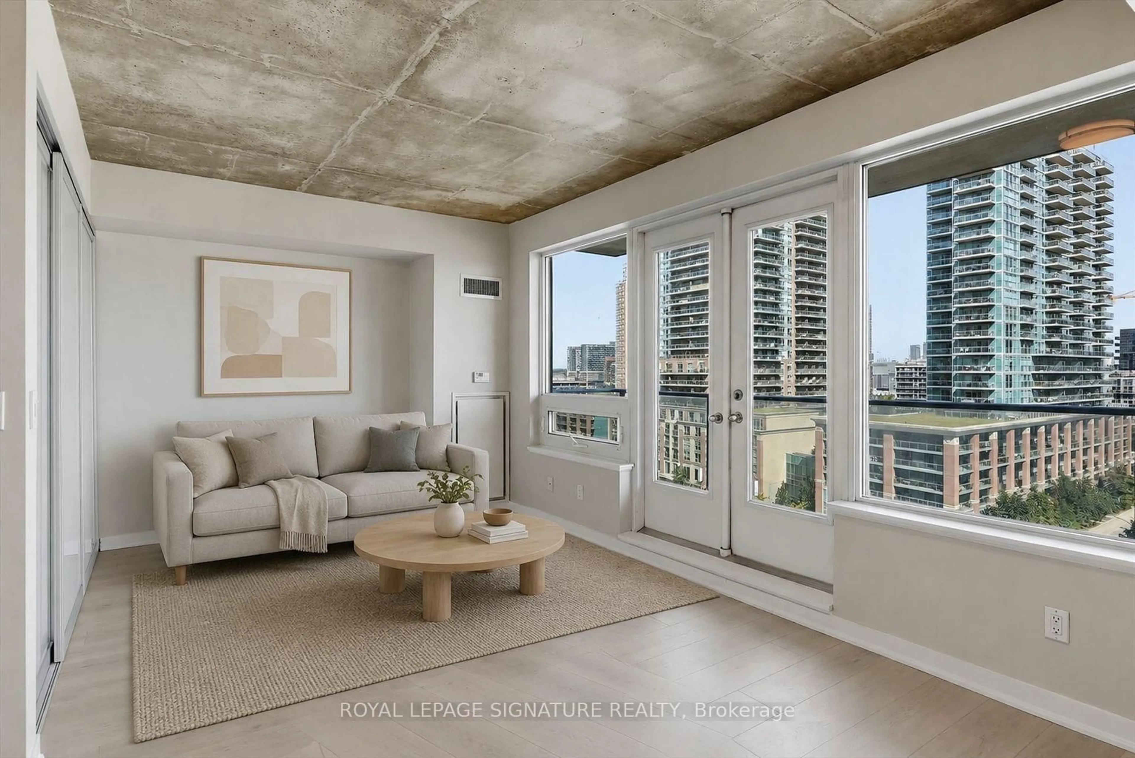 Living room with furniture, cement floor for 59 East Liberty St #1010, Toronto Ontario M6K 3R1