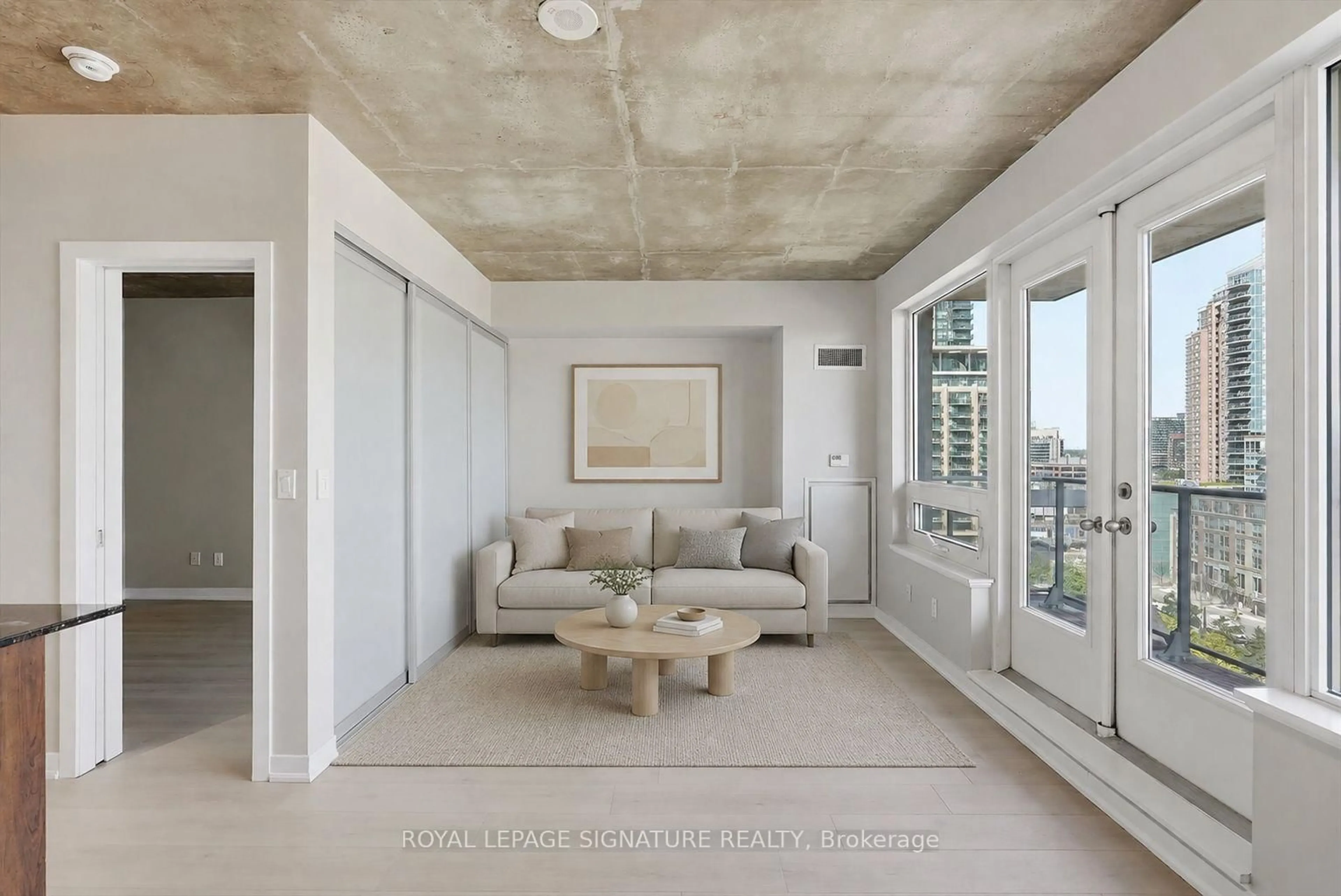 Living room with furniture, cement floor for 59 East Liberty St #1010, Toronto Ontario M6K 3R1