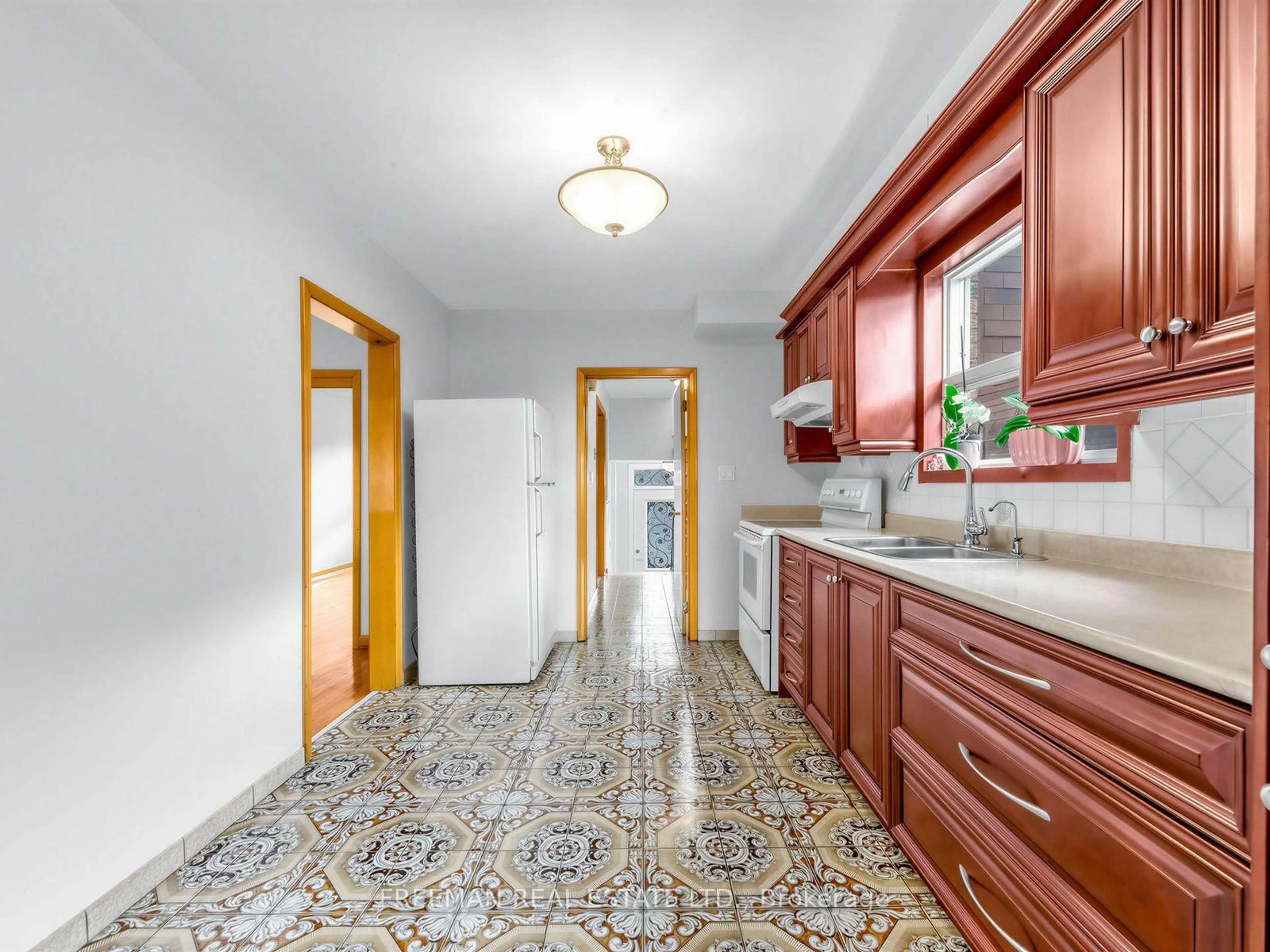 Kitchen with laundary machines, ceramic/tile floor for 380 Glenholme Ave, Toronto Ontario M6E 3E5