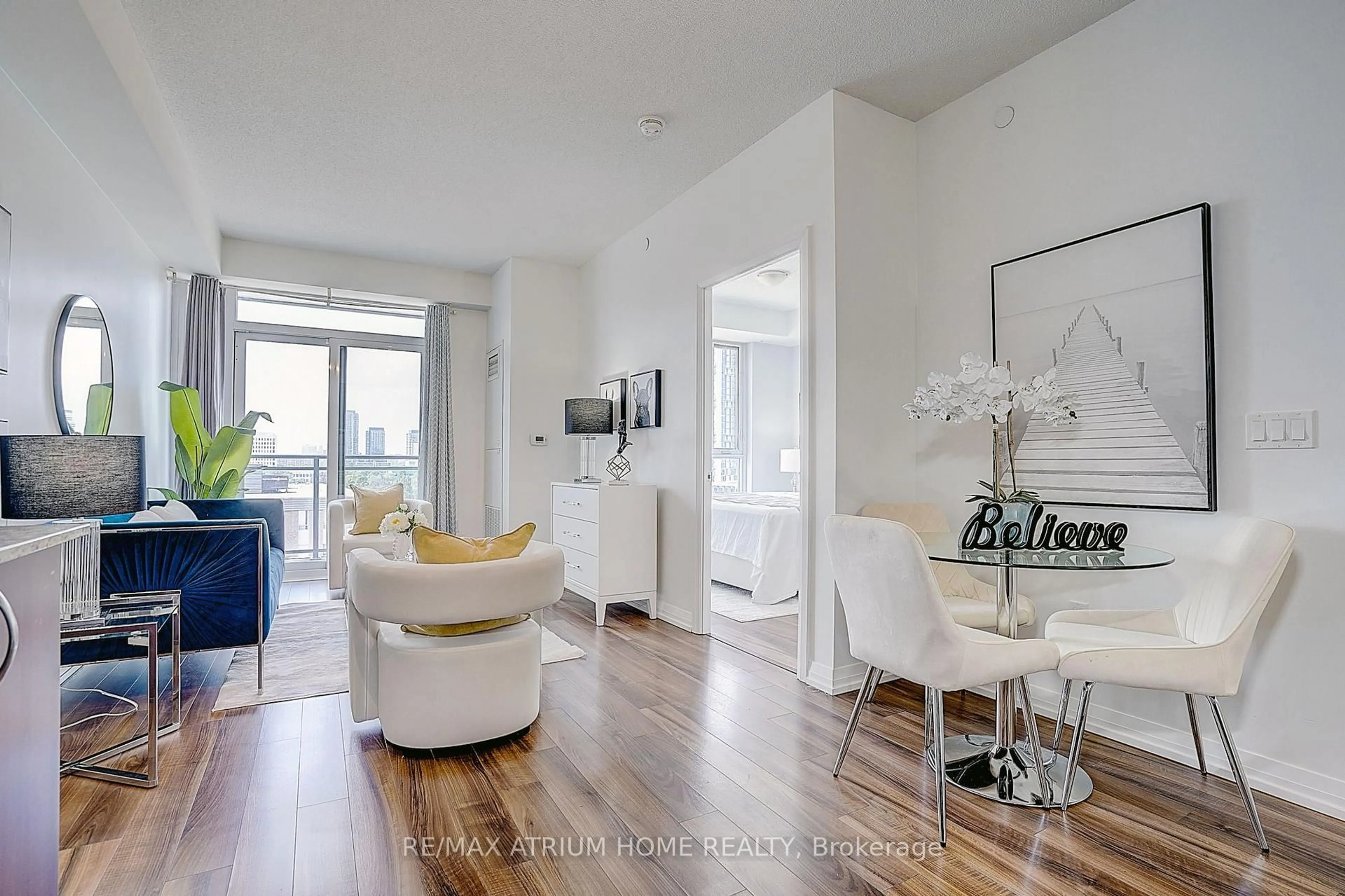 Living room with furniture, wood/laminate floor for 55 Ann O'reilly Rd #810, Toronto Ontario M2J 0E1