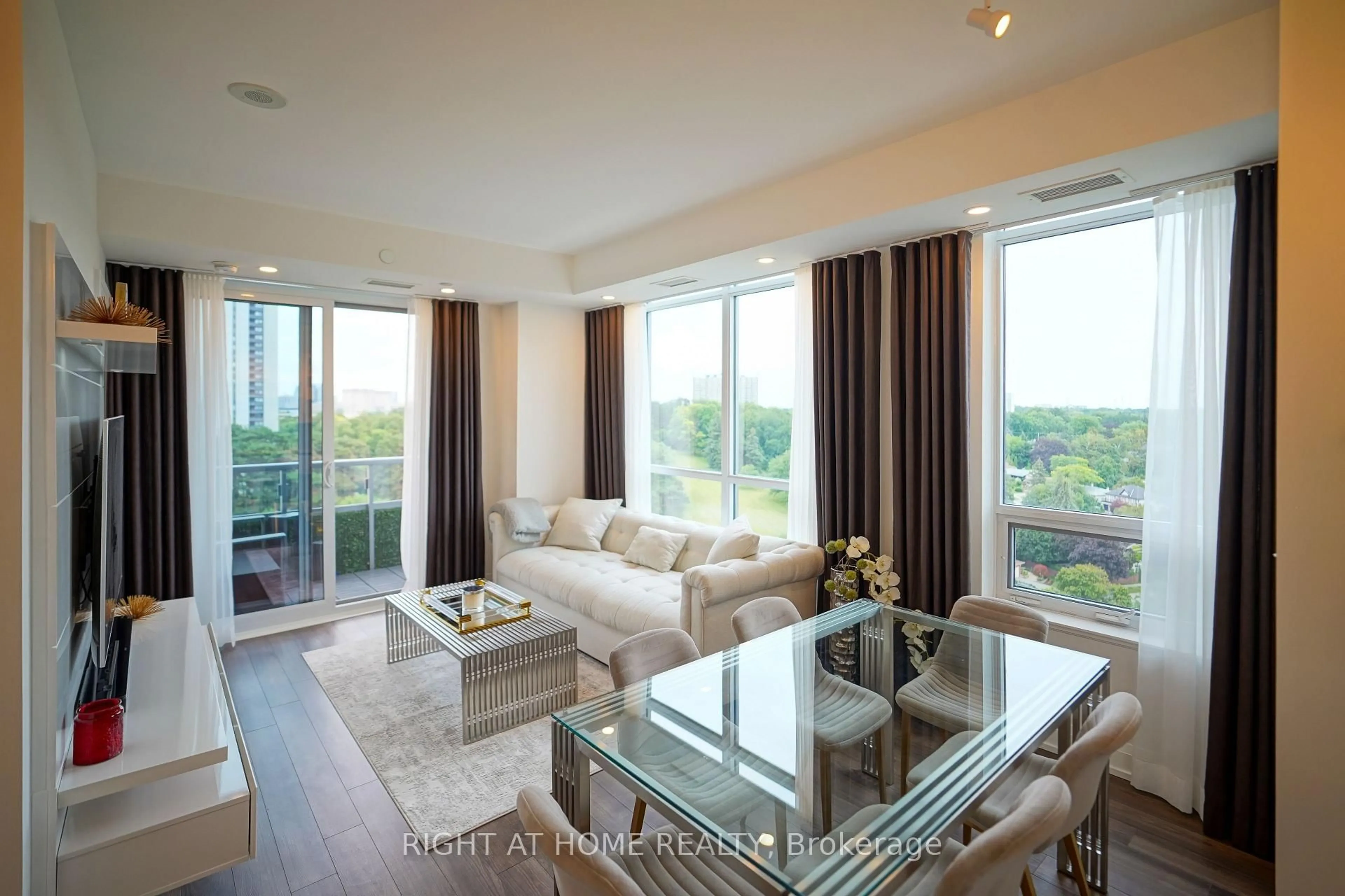Living room with furniture, wood/laminate floor for 18 Graydon Hall Dr #1509, Toronto Ontario M3A 2Z9