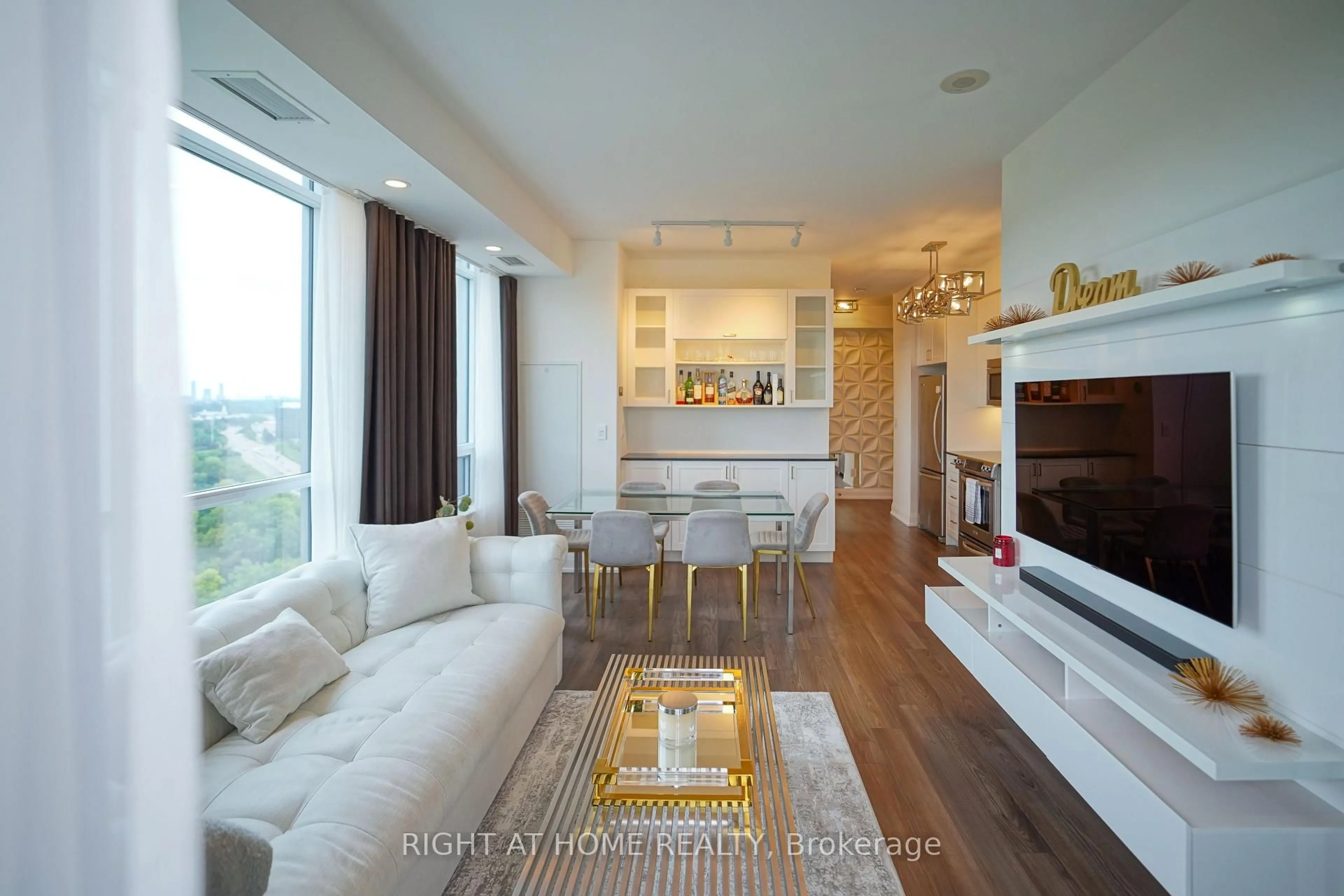 Living room with furniture, wood/laminate floor for 18 Graydon Hall Dr #1509, Toronto Ontario M3A 2Z9
