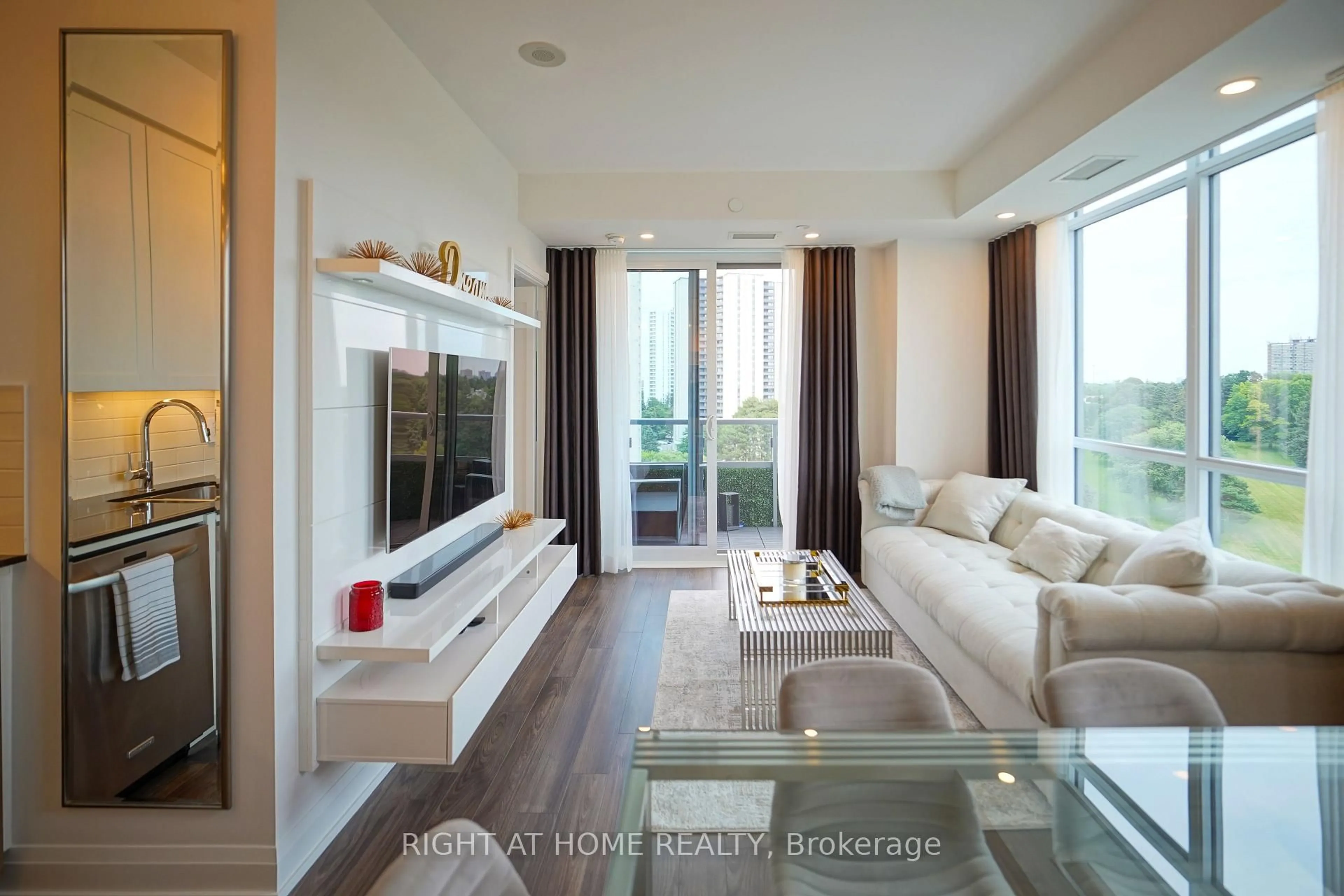 Living room with furniture, wood/laminate floor for 18 Graydon Hall Dr #1509, Toronto Ontario M3A 2Z9