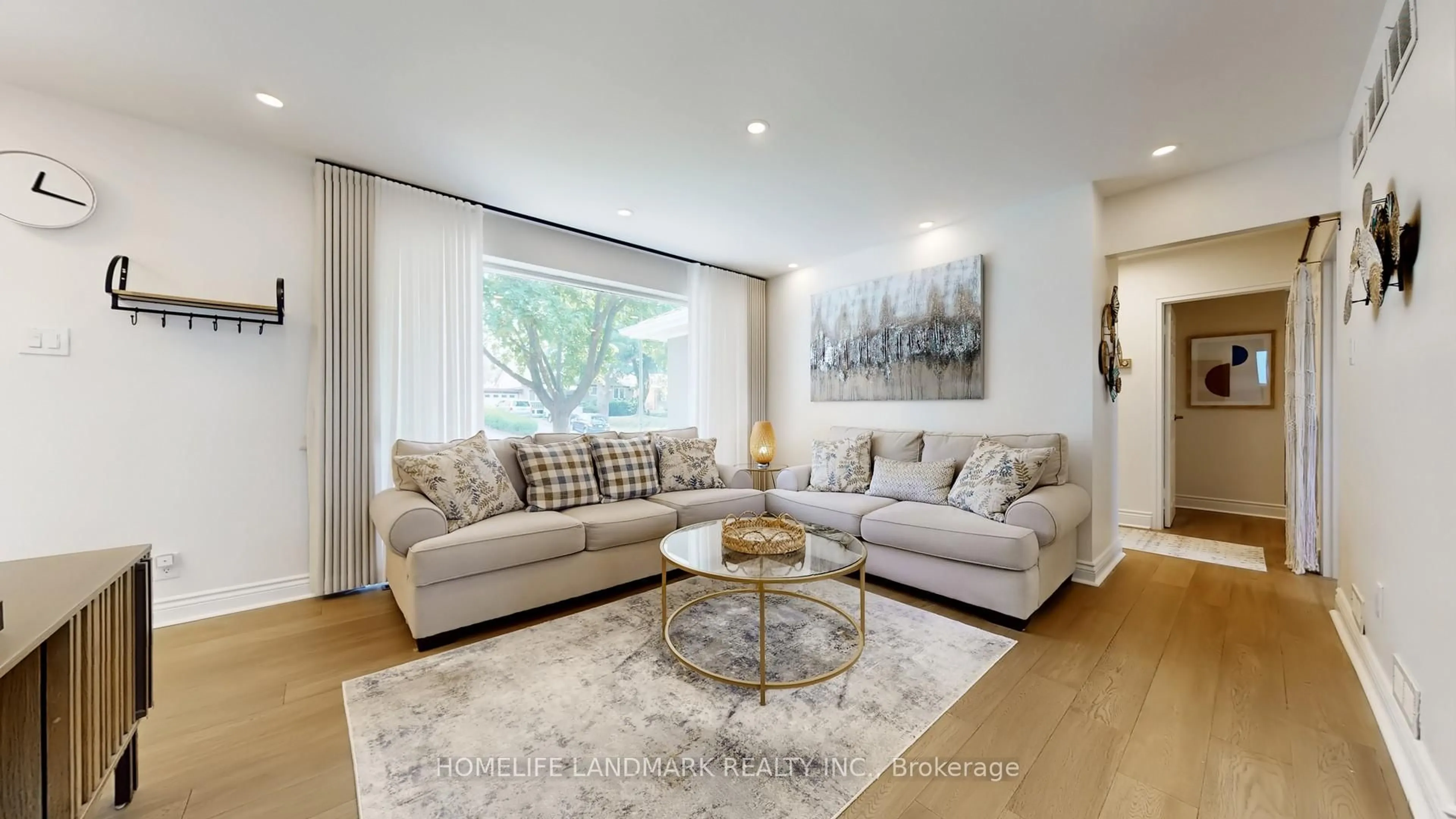 Living room with furniture, wood/laminate floor for 30 Paperbirch Dr, Toronto Ontario M3C 2E7